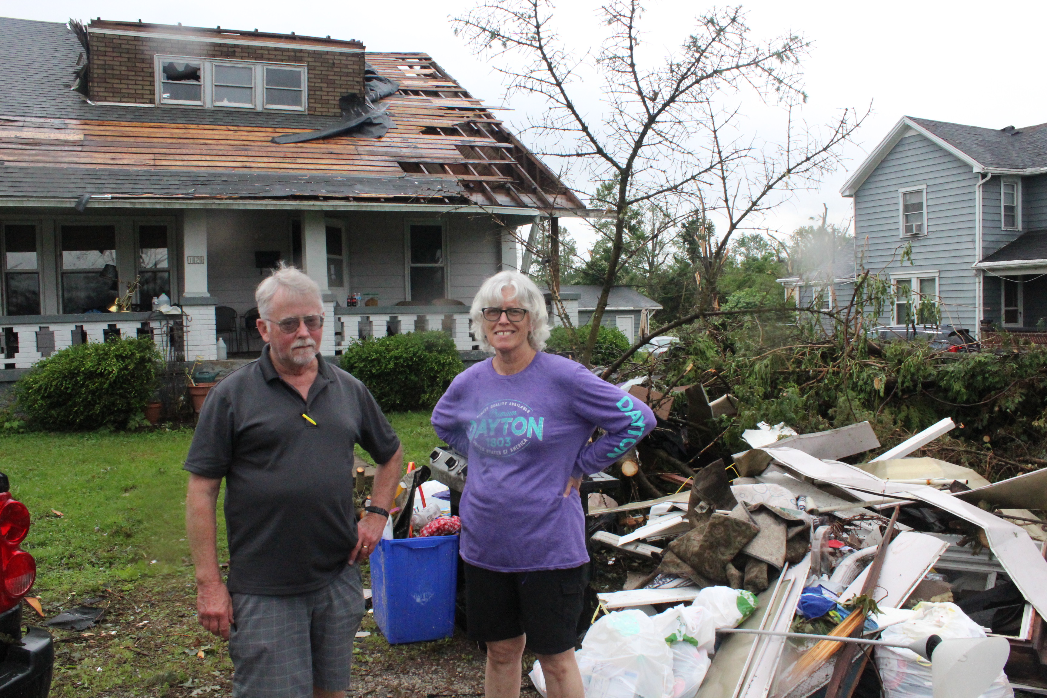 Robin and Chris Sassenberg of Dayton. Friends and volunteers from Oregon District business helped the couple remove debris and secure their Hilldsale Avenue home in the wake of the Memorial Day tornadoes. Photos by Amelia Robinson