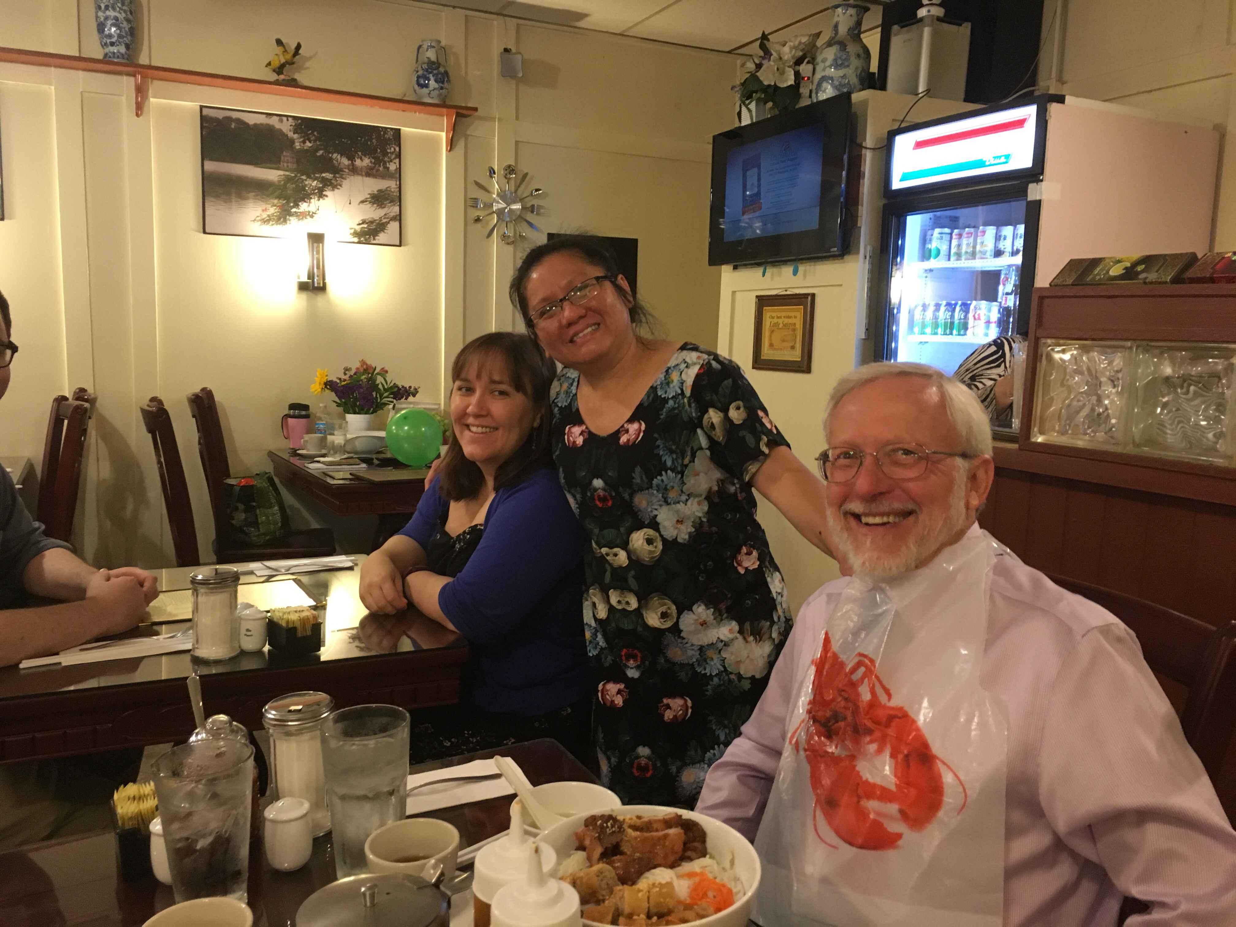 Little Saigon Restaurant co-owner, Thauh Do “T.D.” Tran, visits with some of the restaurant's most regular customers.