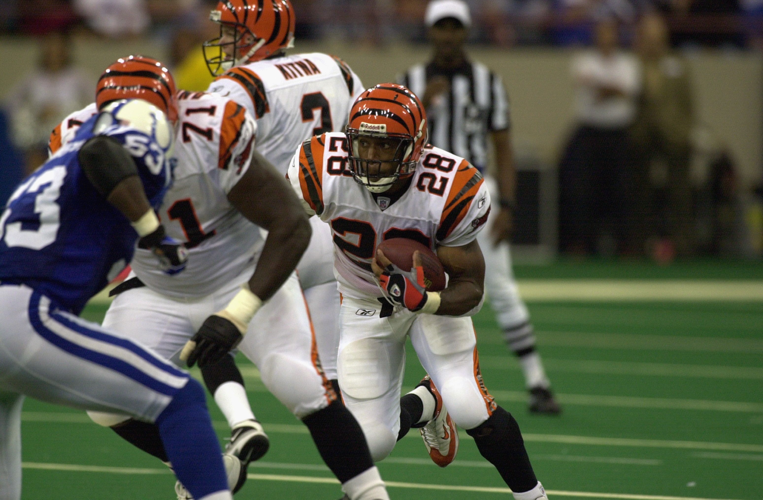 Former Cincinnati Bengals players Tim Krumrie, left, Max Montoya