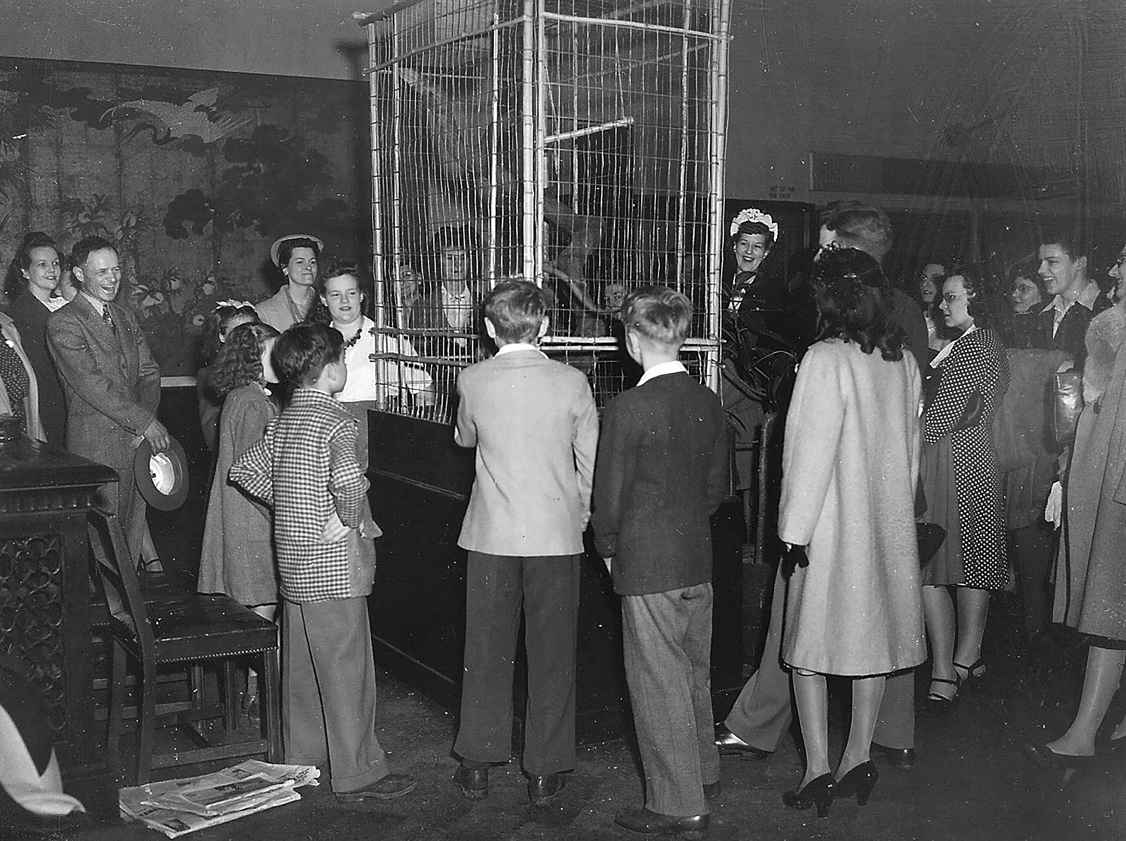 A crowd gathers around a cage to see Skipper the monkey at the Dayton Art Institute. Siegfried R. Weng, who at age 25 became the museumâs first director, created a zoo to attract visitors during the 1930s and 1940s. DAYTON ART INSTITUTE