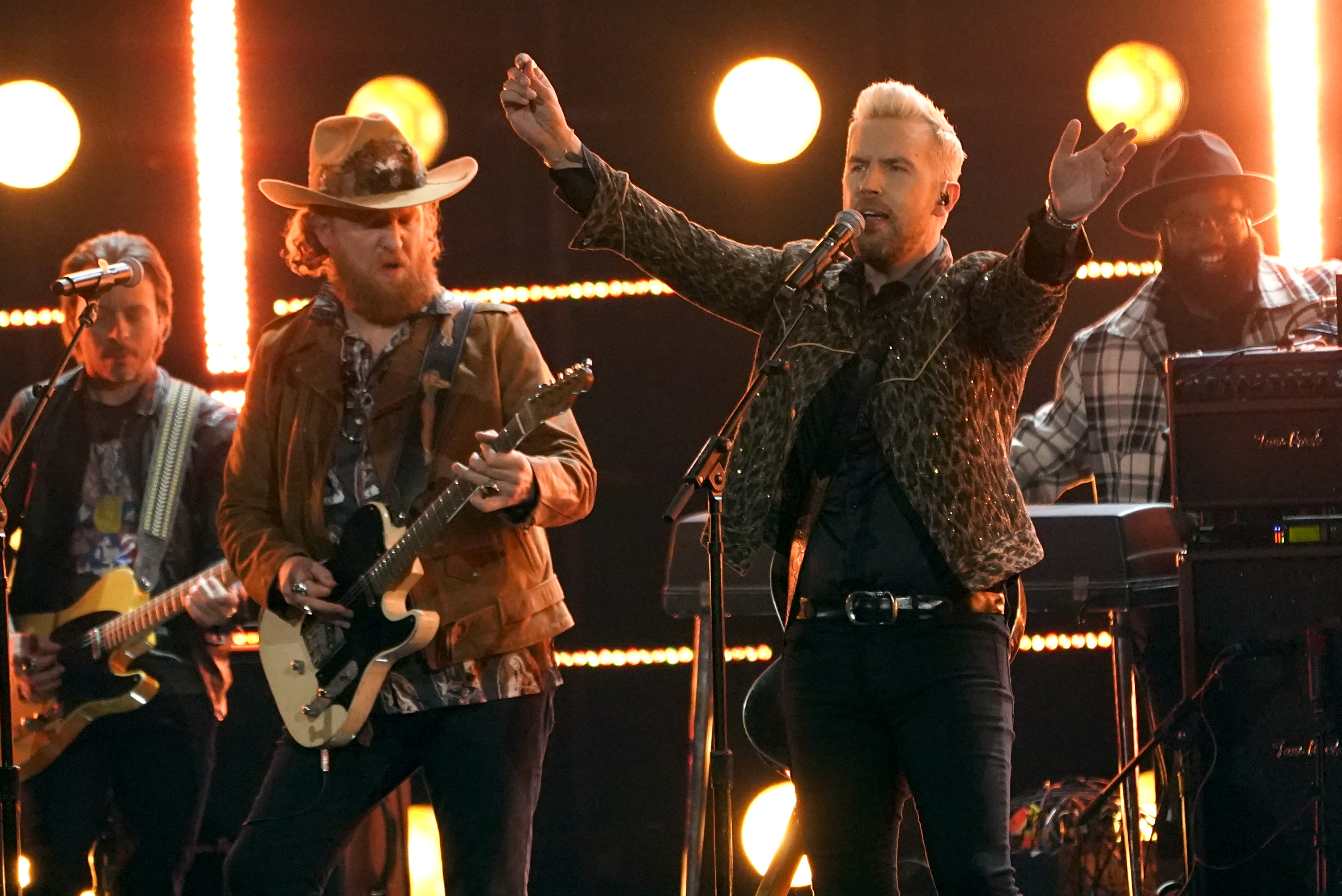 John Osborne, left, and T.J. Osborne of Brothers Osborne performs "Dead Man's Curve" at the 64th Annual Grammy Awards on Sunday, April 3, 2022, in Las Vegas. They will perform Aug. 26, 2022 at the Rose Music Center at The Heights. (AP Photo/Chris Pizzello)