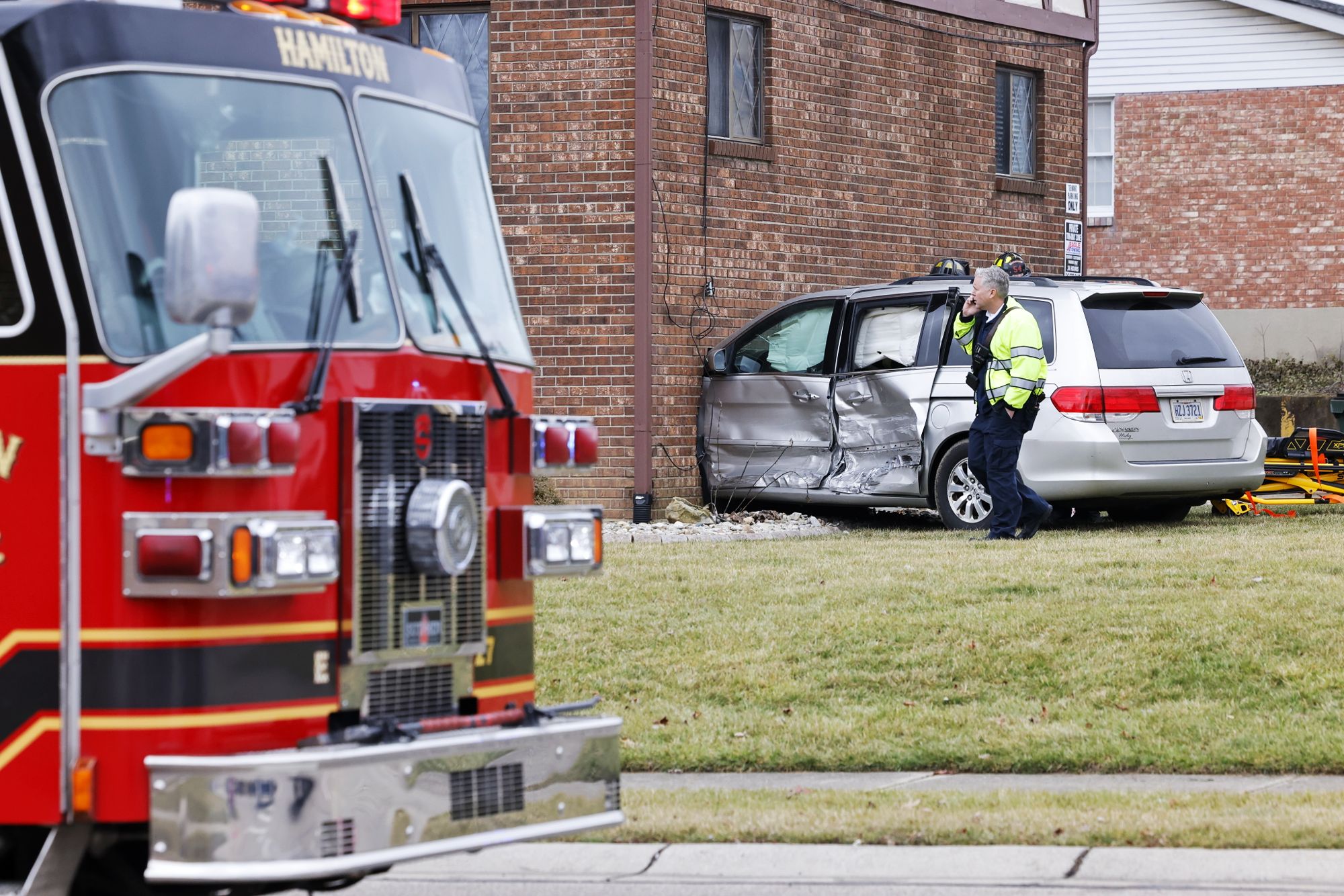 Hamilton crash: Van strikes apartment building after collision with sedan;  one hurt