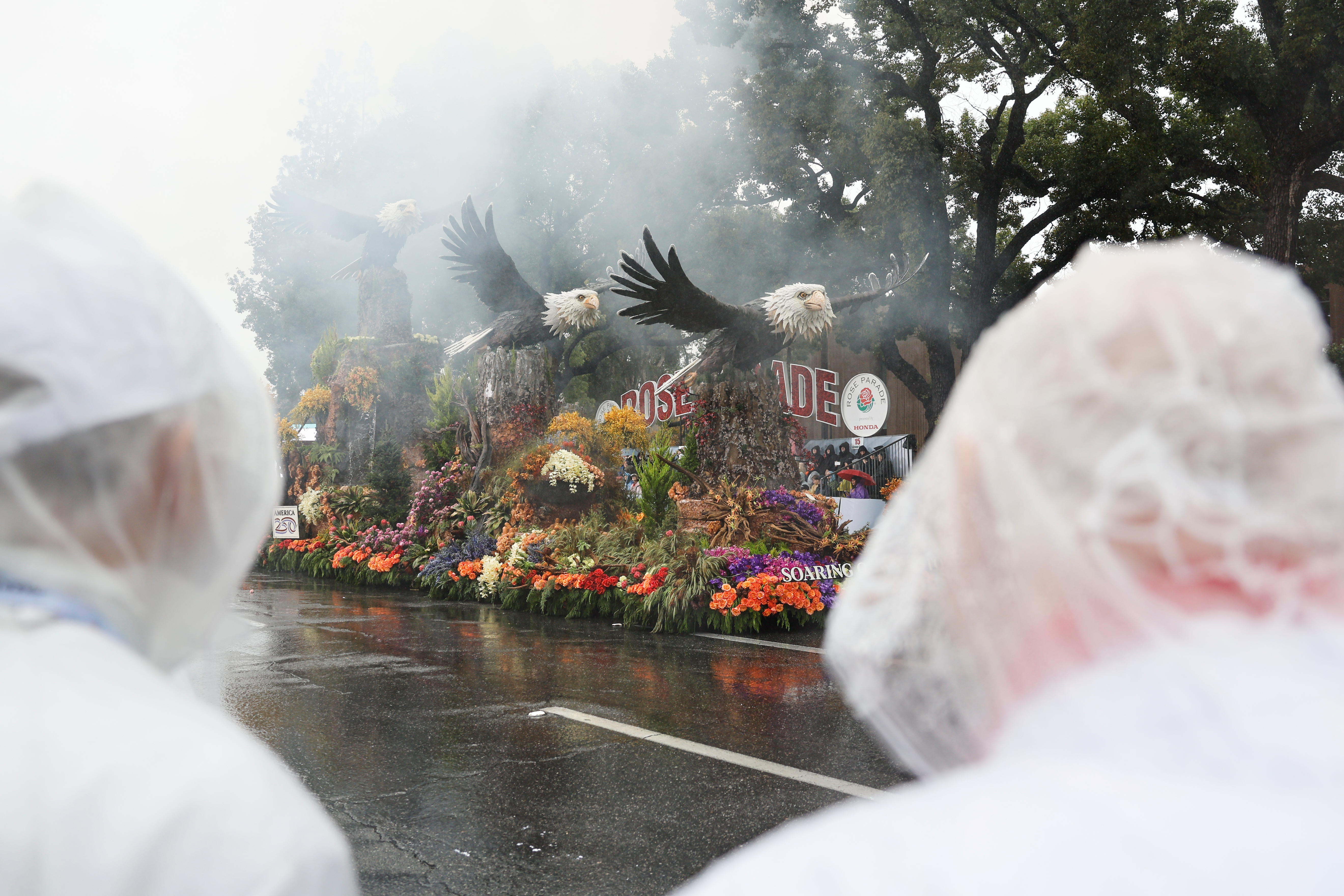 Rain soaks Rose Parade in California and snow squalls hit Midwest and Northeast on first day of 2026