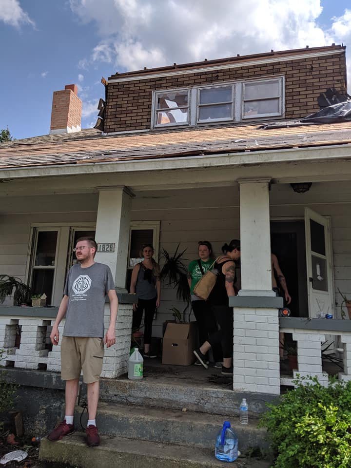 Friends and volunteers from the Oregon District worked to secure and clear Robin and Chris Sassenberg's Hillsdale Avenue home of debris the day following the Memorial Day tornadoes.