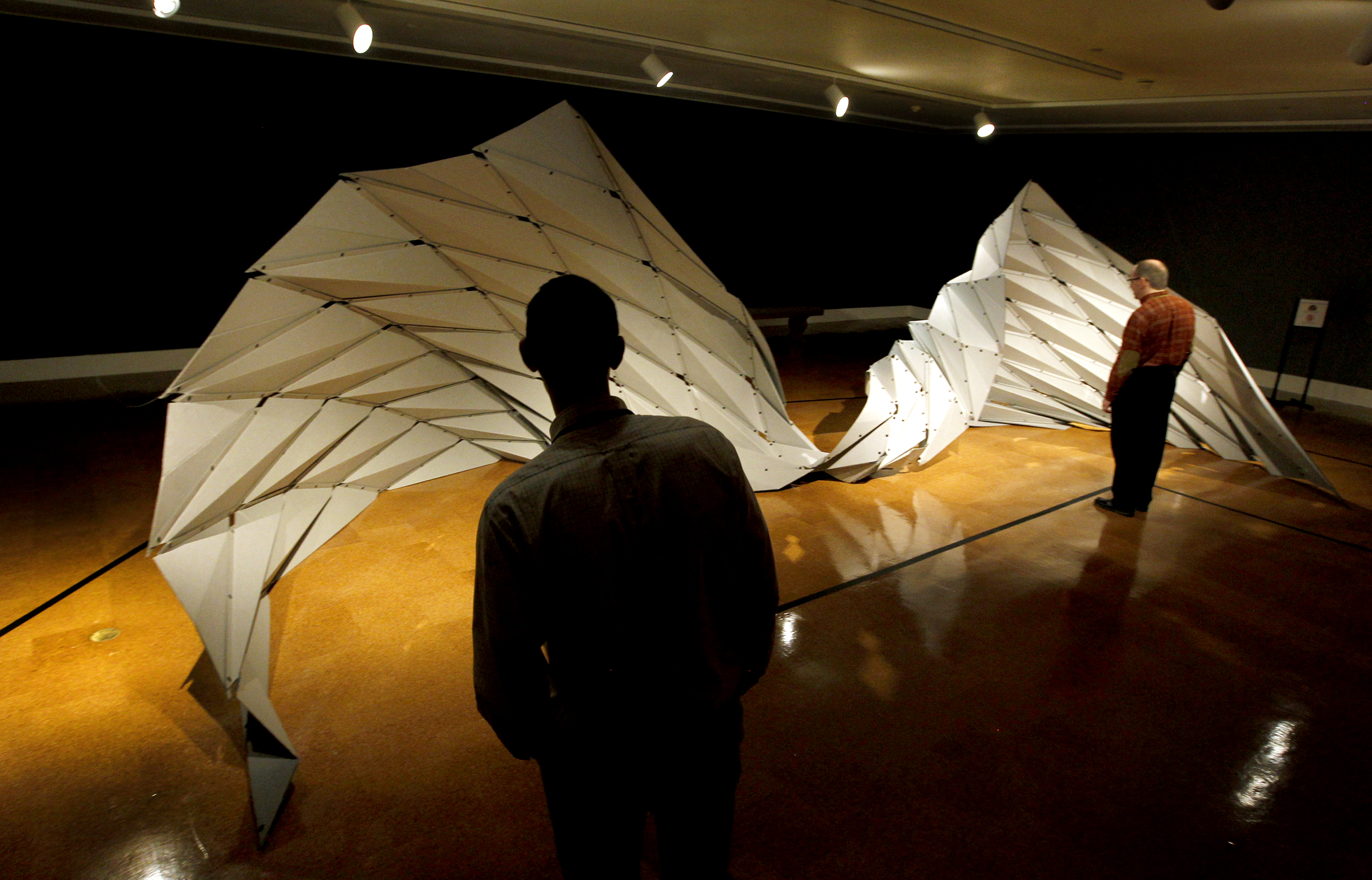 "Ruga Swan," by artist Jiangmei Wu, is one of the pieces in the Dayton Art Institute origami exhibit, Above the Fold: New Expressions in Origami. LISA POWELL / STAFF