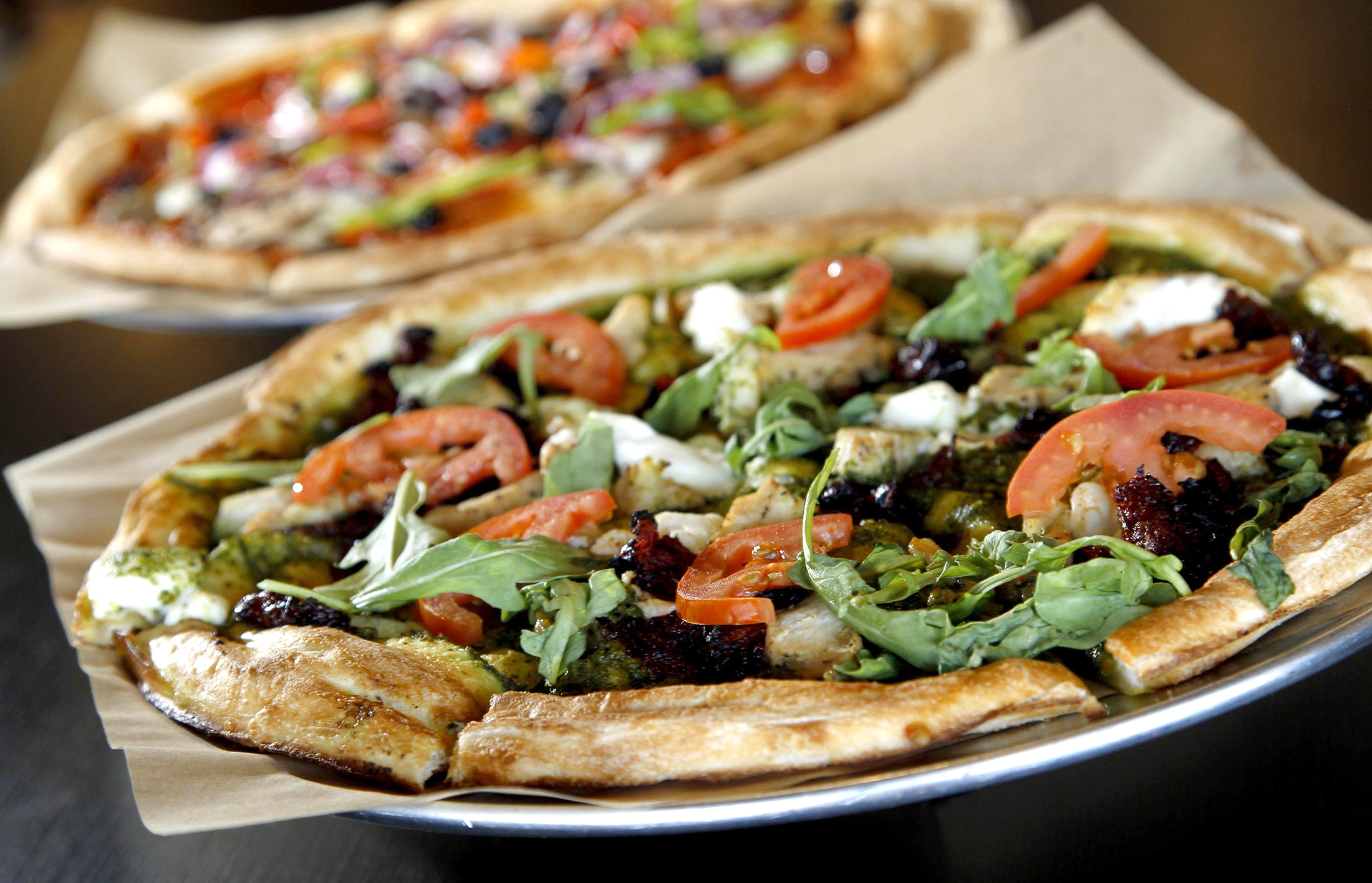 Ray Wiley and his business partners have recently opened Rapid Fired Pizza in Washington Twp. Customers order custom made pizza in a serving line similar to Chipotle in the new "fast-casual" chain. LISA POWELL / STAFF