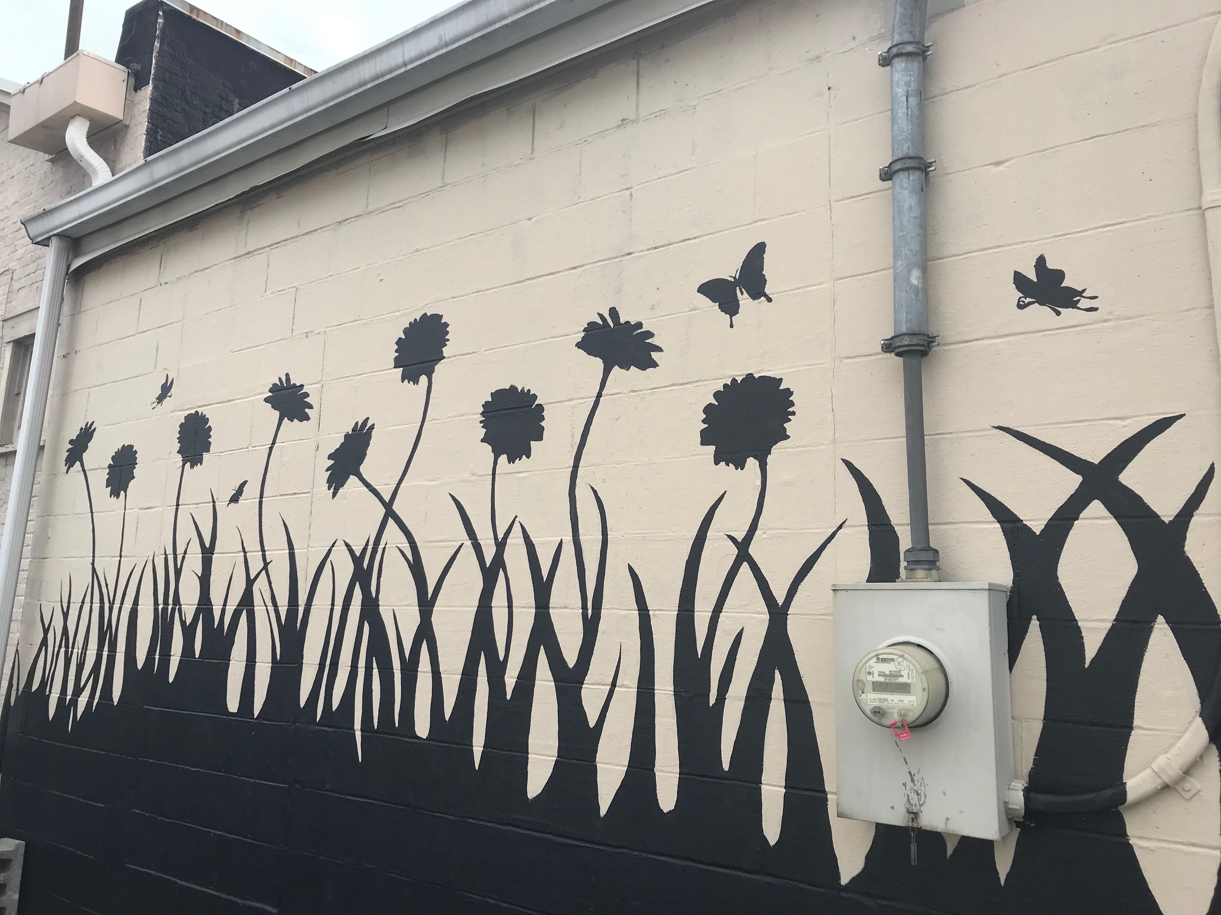 Nine flowers represent the nine victims of the Oregon District shooting.