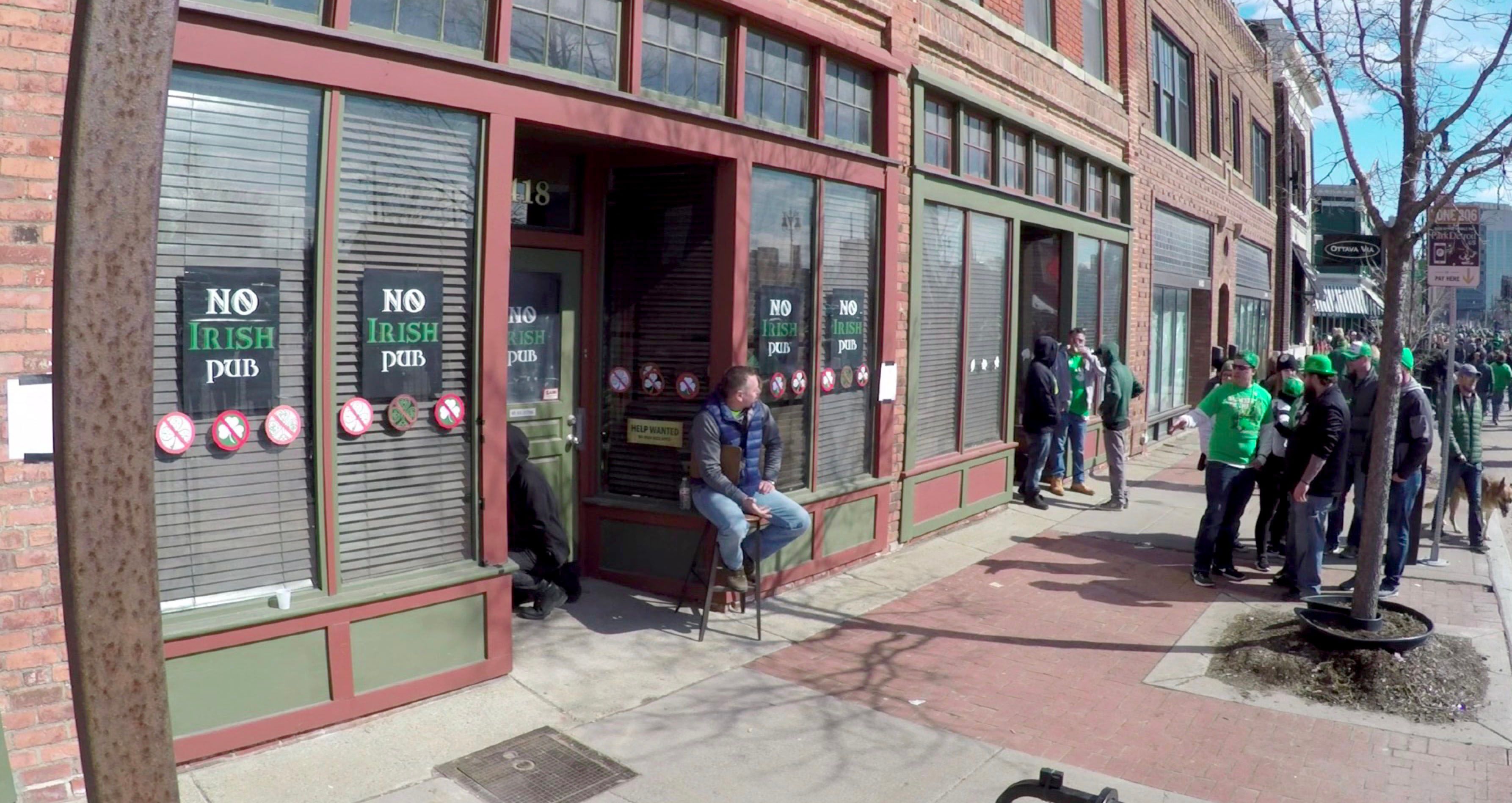 Bill Johns acted as a bouncer Sunday, March 10 2018 outside the "No Irish Pub,” a fake pub set up for one day on Michigan Avenue in Detroit as part of an experiment to raise awareness about how poorly Irish immigrants were once treated in the U.S., and to make people think about how immigrants are treated today.