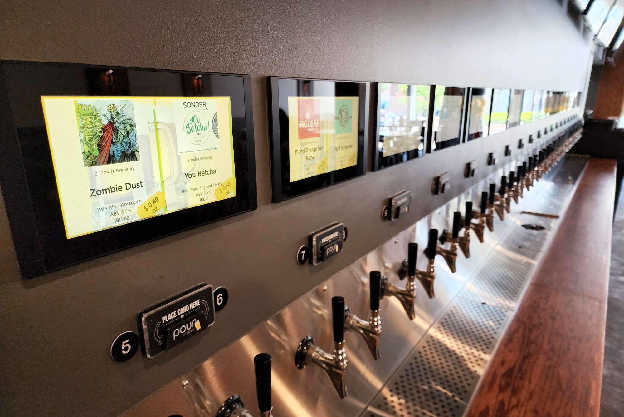 Pour House self-pour tap room opened Friday, May 13, 2022 in The Marcum building in downtown Hamilton. Pour House features 42 taps with a mixture of craft, import and domestic beers, along with a menu of pizza and appetizers. NICK GRAHAM/STAFF