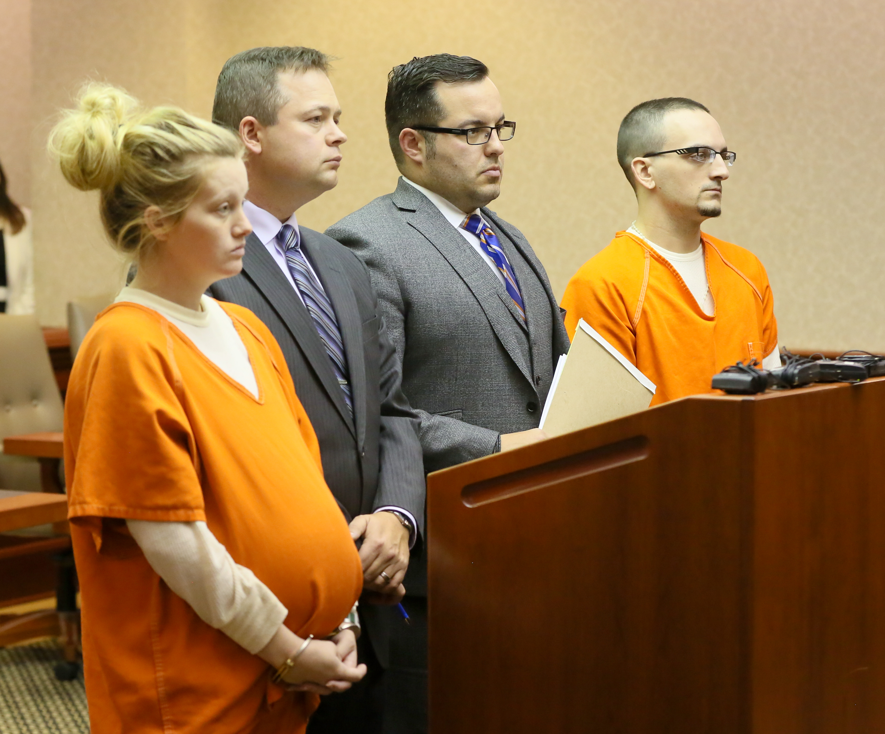 A pregnant Rebekah Kinner and her boyfriend, Bradley Young, appear with their attorneys in Butler County court for a trial date setting.