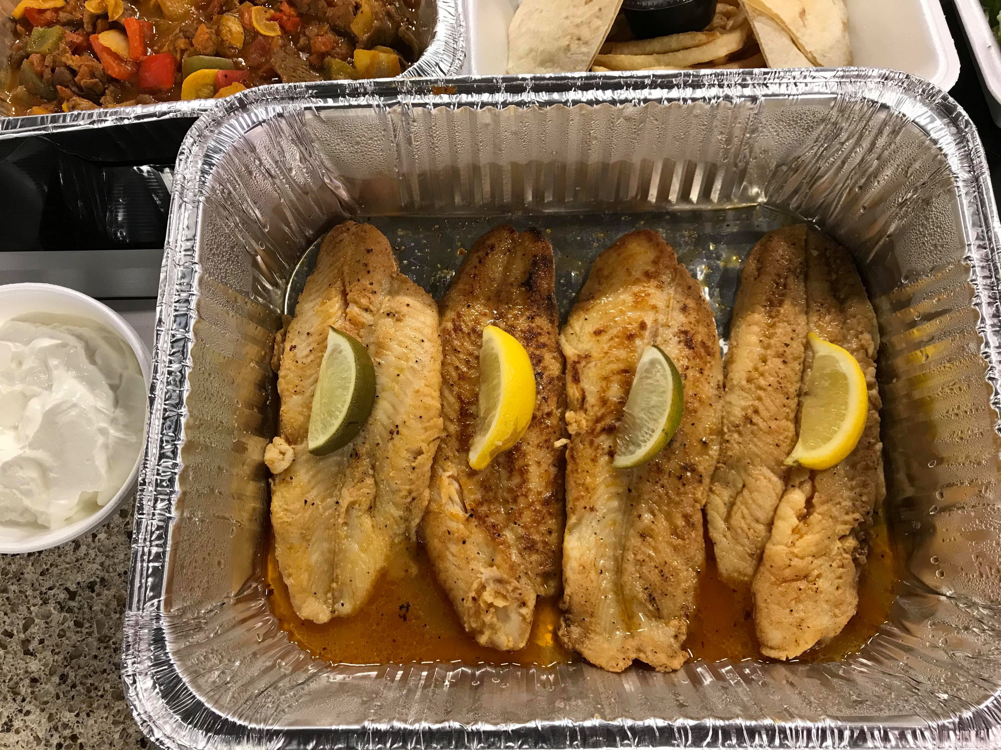 El Meson is among the restaurants offering carryout and curbside serve. Filet of fish for four is pictured.