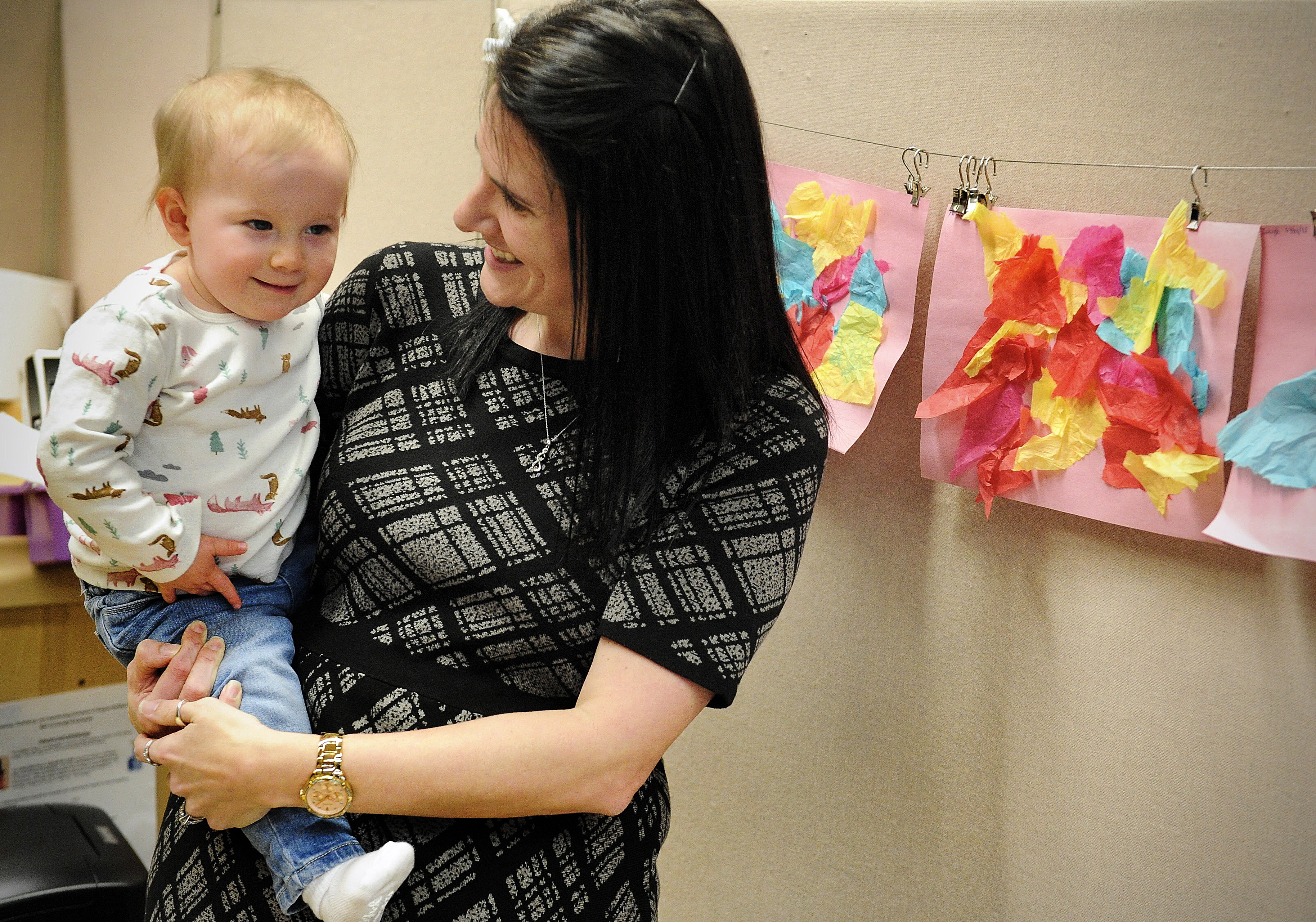 Nicole Myrick, director of the Mini University talks to one of the children at the daycare center Wednesday March 9, 2022. MARSHALL GORBY\STAFF