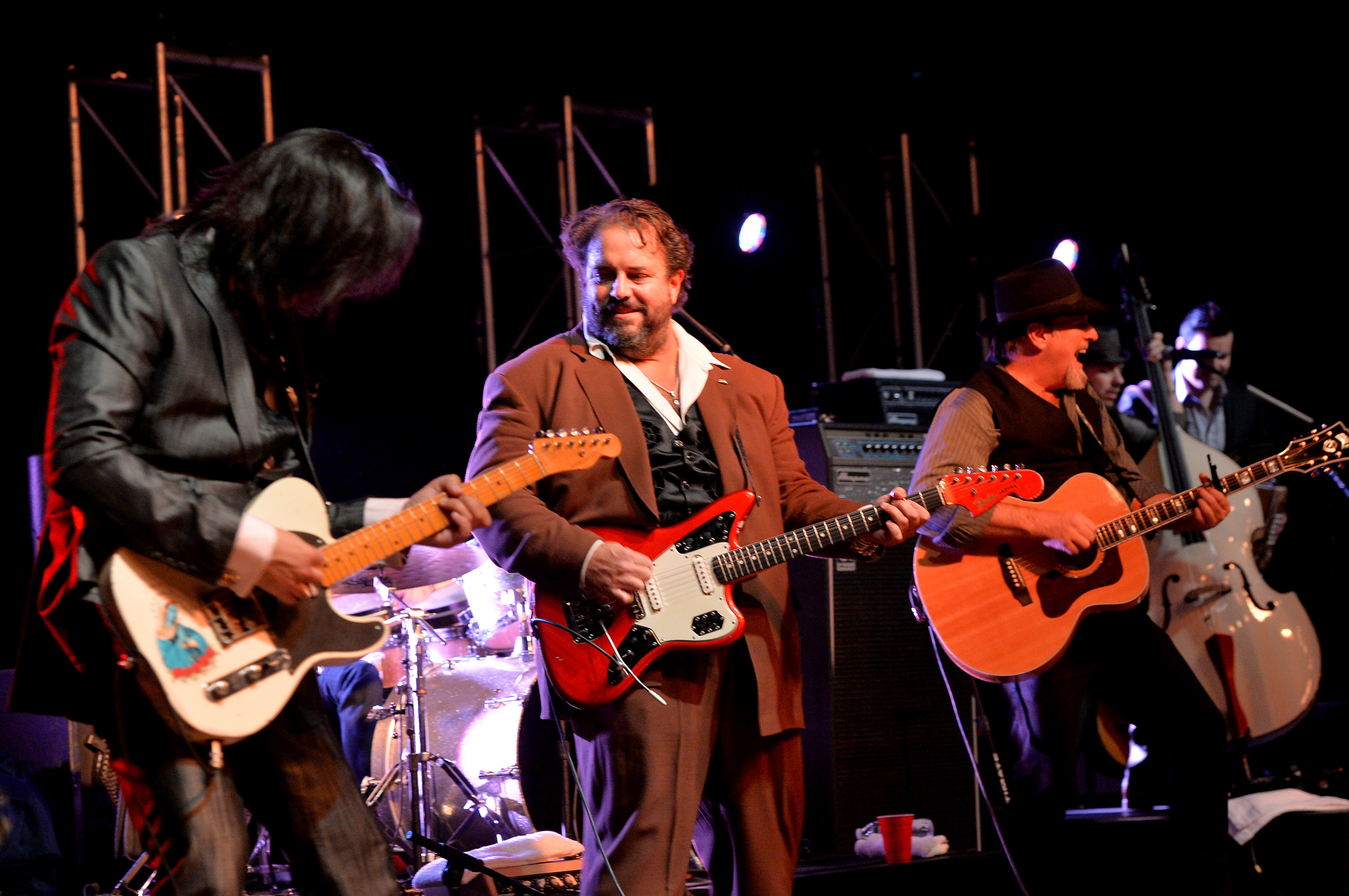 NASHVILLE, TN - OCTOBER 20: Eddie Perez, Raul Malo and Robert Reynolds of The Mavericks perform at the Paradigm party during the IEBA 2013 Conference - Day 1 at the The Omni Hotel on October 20, 2013 in Nashville, Tennessee. (Photo by Rick Diamond/Getty Images for IEBA)