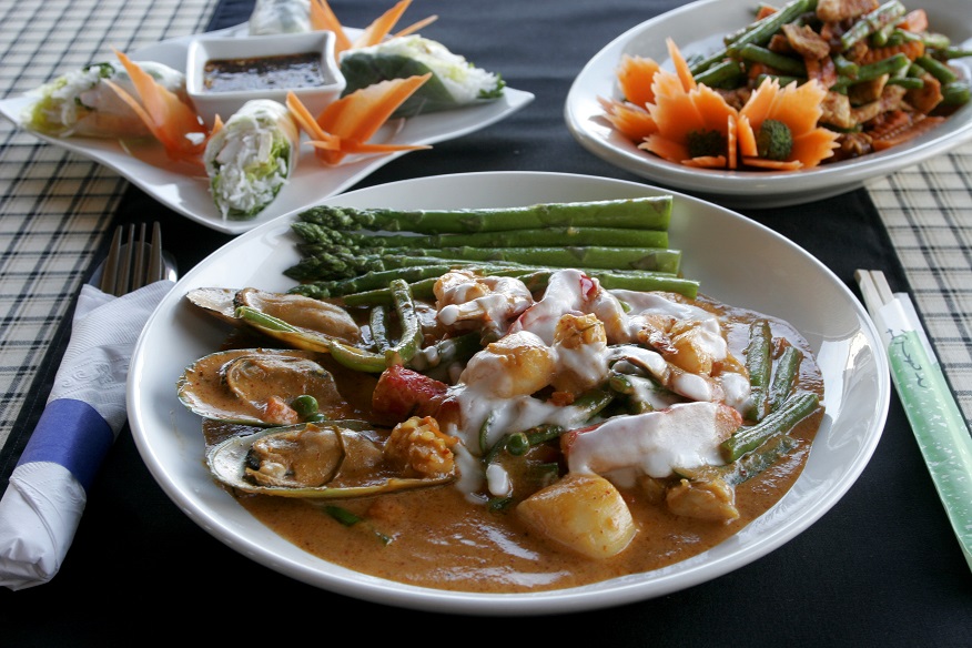 Siam Pad Thai's Panang Curry with Seafood, (clockwise from front) the Soft Roll, and Chicken Spicy Green Bean. 2009 file photo by Jan Underwood
