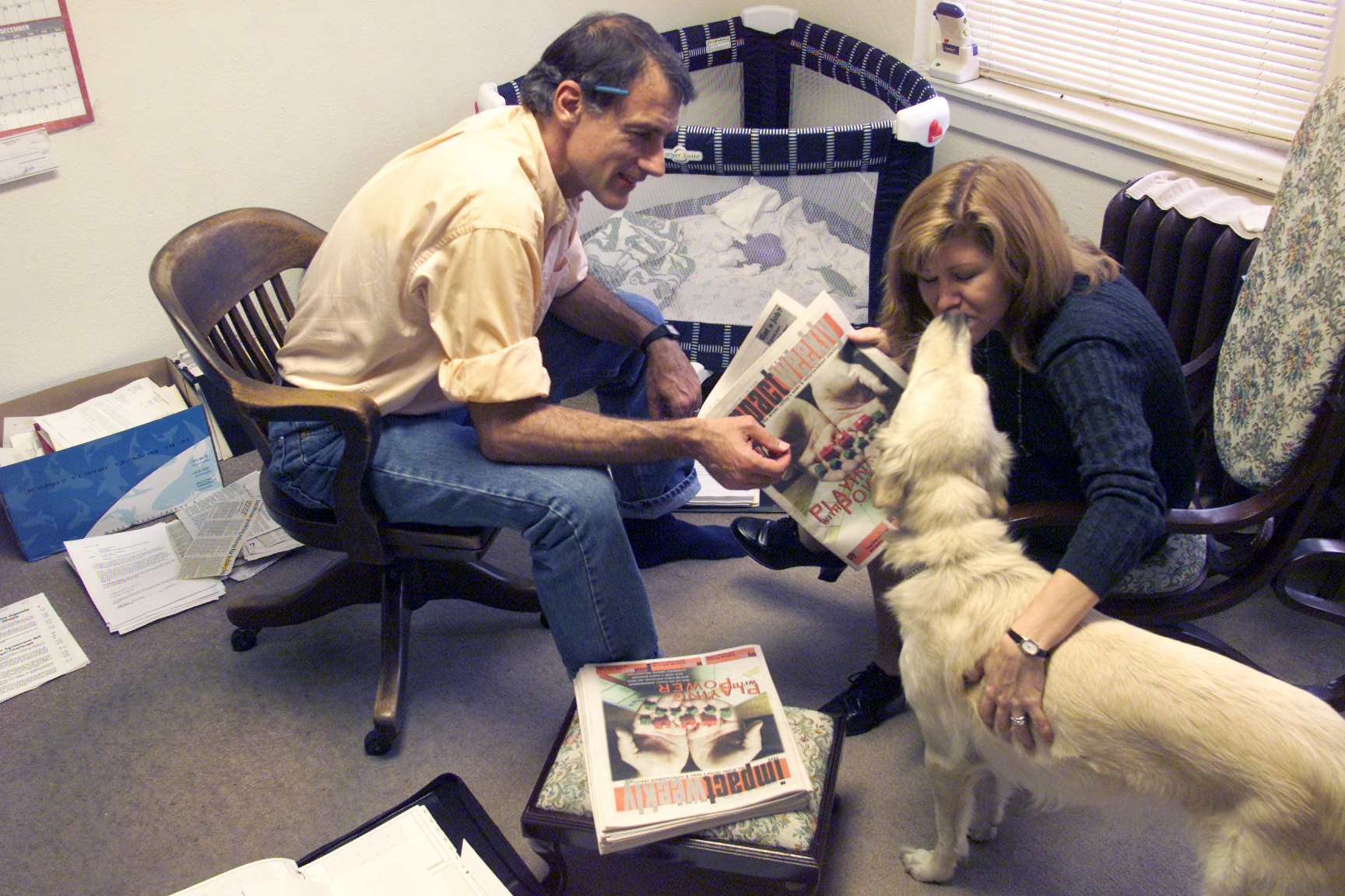 10/23/1999 archived photo: Jeff Epton and Marrianne McMullen work as co-publishers at Impact Weekly where they used to be owners. The couple also bring a part of their home life with them to work, including their dog Idgie and sometimes their baby.