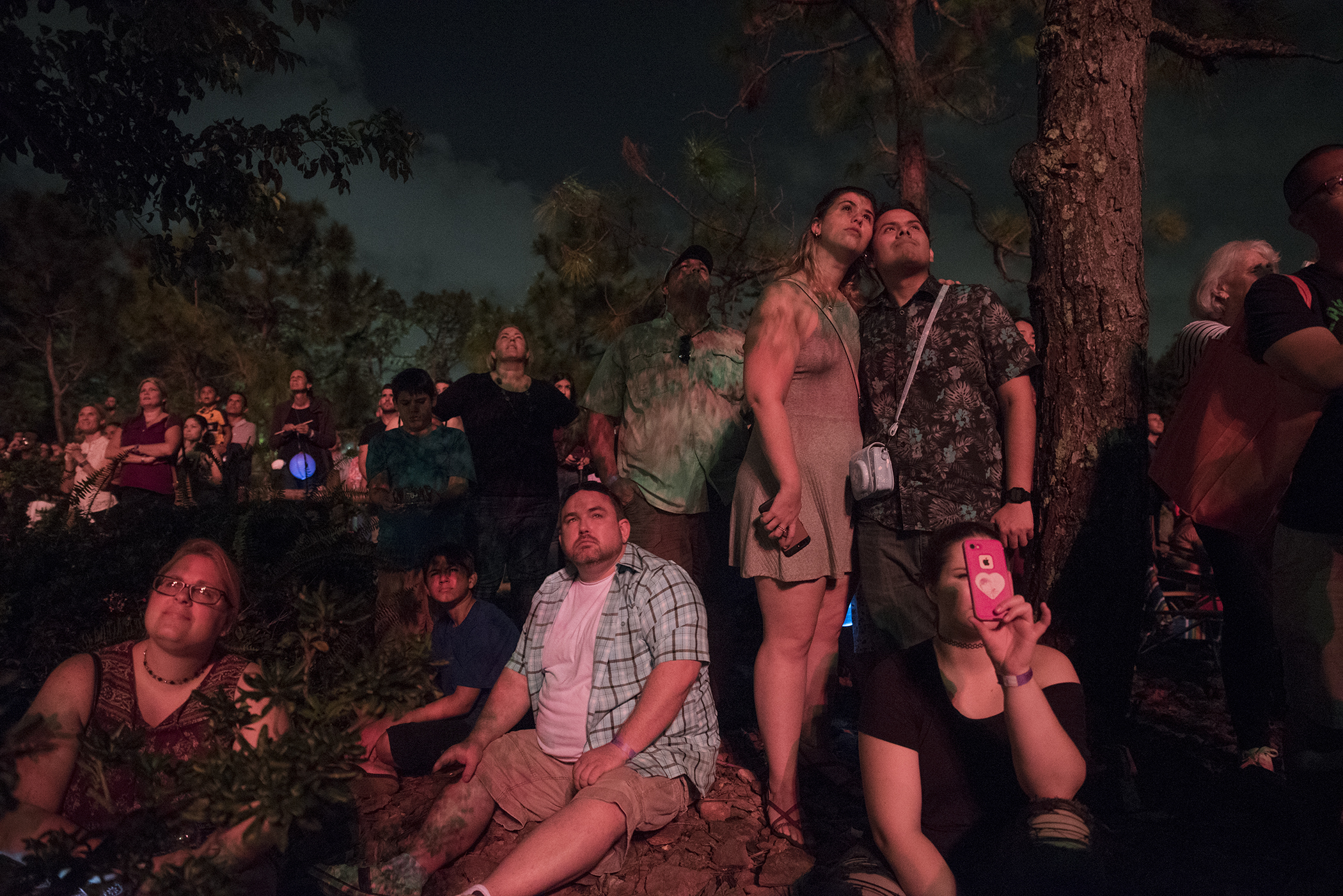 Lauren Uffner of Hollywood, Fla., center left, and Ozzy Morin of North Miami Beach, embrace while watching the fireworks show during the 40th annual Morikami Lantern Festival at the Morikami Museum in Delray Beach, Fla., on Saturday, October 21, 2017. The festival, which is inspired by the Japanese summer Obon festival, drew almost 5000 to celebrate the memories of loved ones with dances, games and the lighting of floating lanterns. (Andres Leiva / The Palm Beach Post)