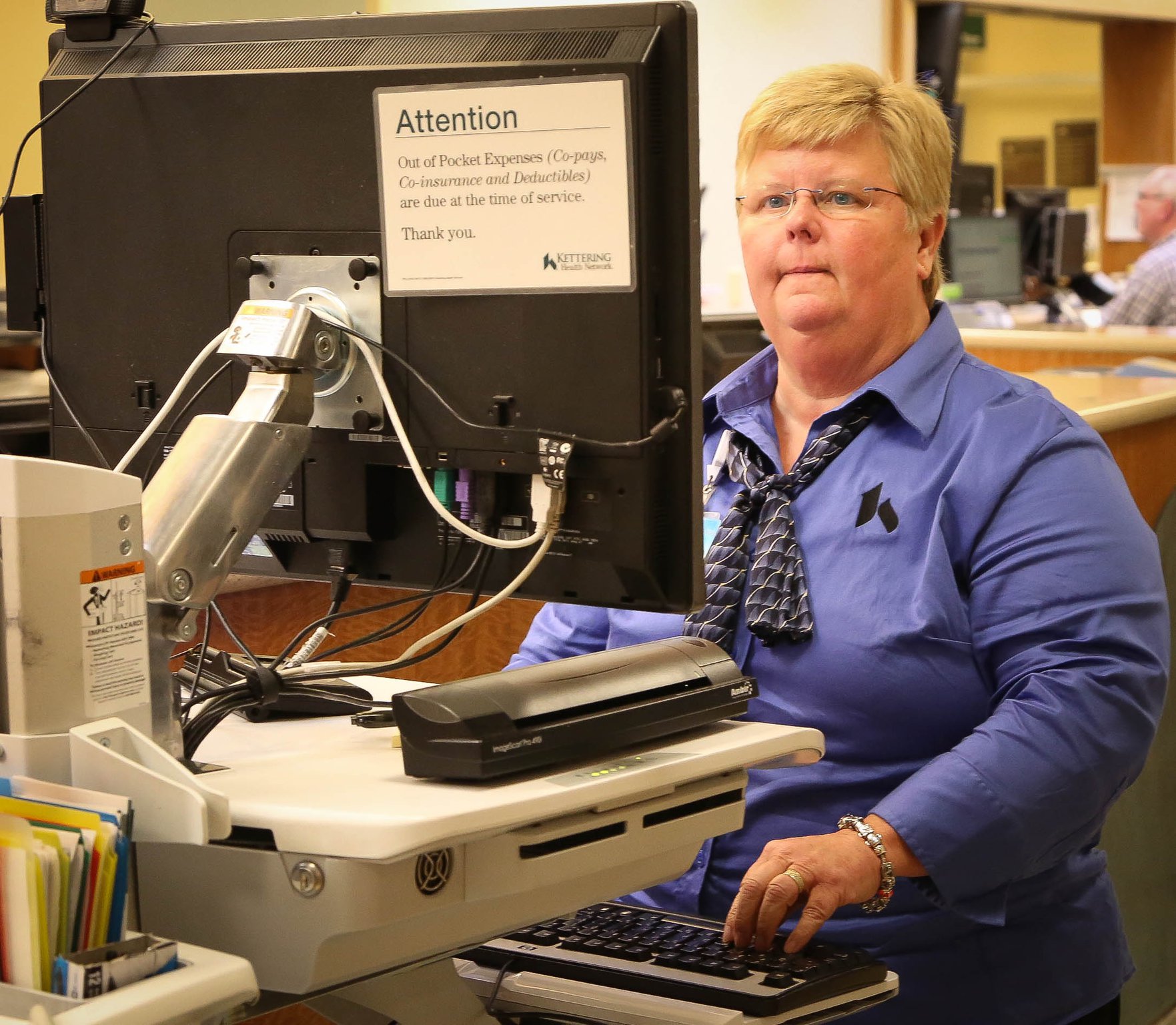 Donna Bush, Patient Financial Counselor at Kettering Medical Center enters data in the Emergency Department. Kettering Health Network tries to prevent people fraudulently obtaining medical care using stolen identities. They request to take a picture of people who present at the emergency room - although it is voluntary. They also ask a variety of questions to see if the information the patient gives matches what the electronic record shows for the person is claiming to be. JIM WITMER/STAFF