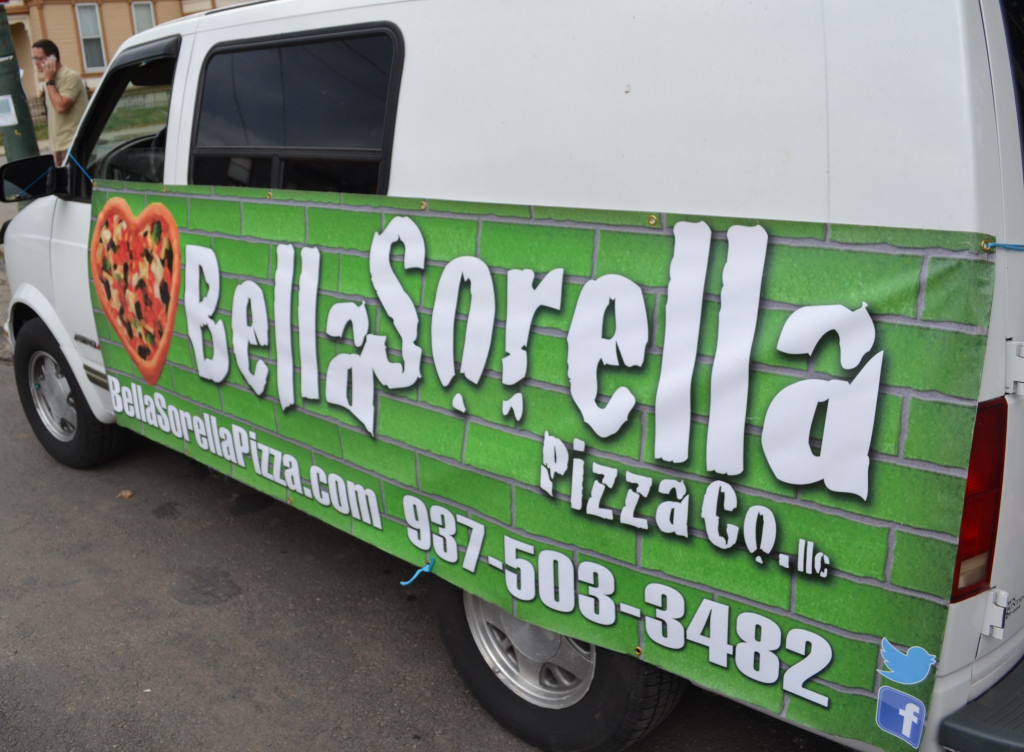 Dayton’s newest food truck is a mobile food van that tows a wood-fired brick pizza oven behind it. Photo by Mark Fisher