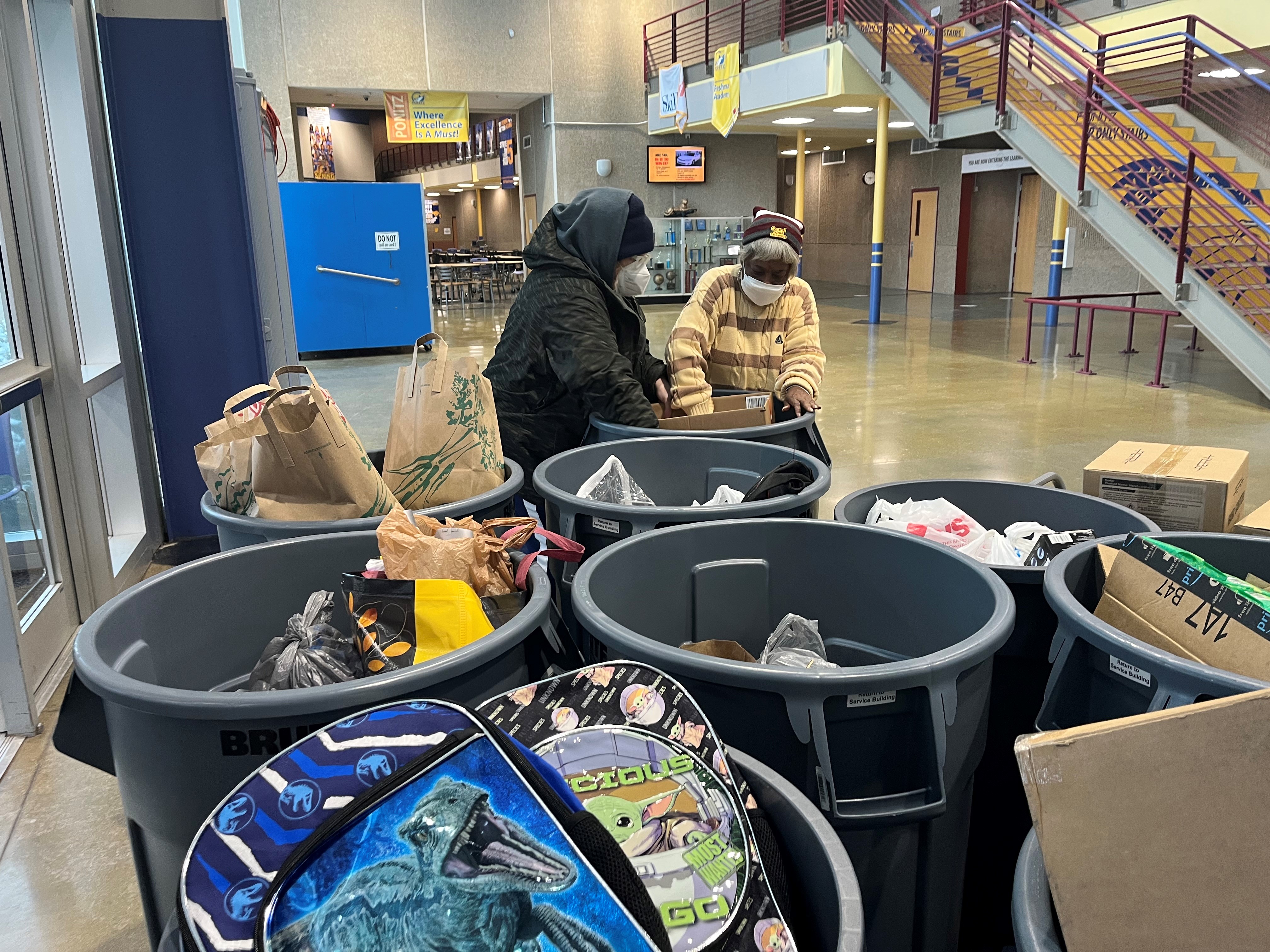 Volunteers collect donations to benefit homeless students in the Dayton Public Schools district. CORNELIUS FROLIK / STAFF