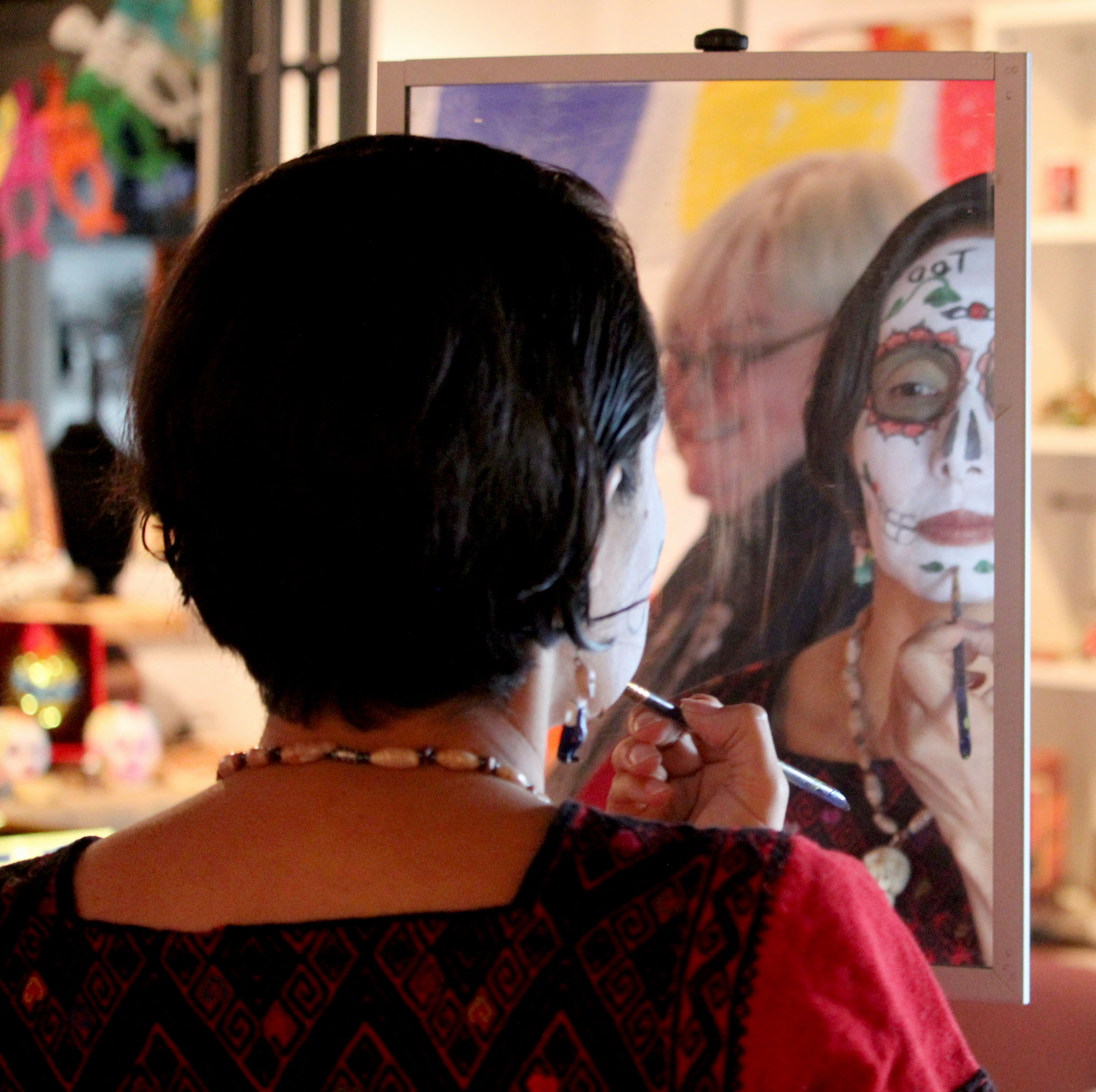 Dayton has celebrated El Dia de los Muertos since 2012. Gabriela Pickett, the owner of Missing Peace Art Space, is an organizer. Artist MB Hopkins can be seen in the background. Photo Amelia Robinson