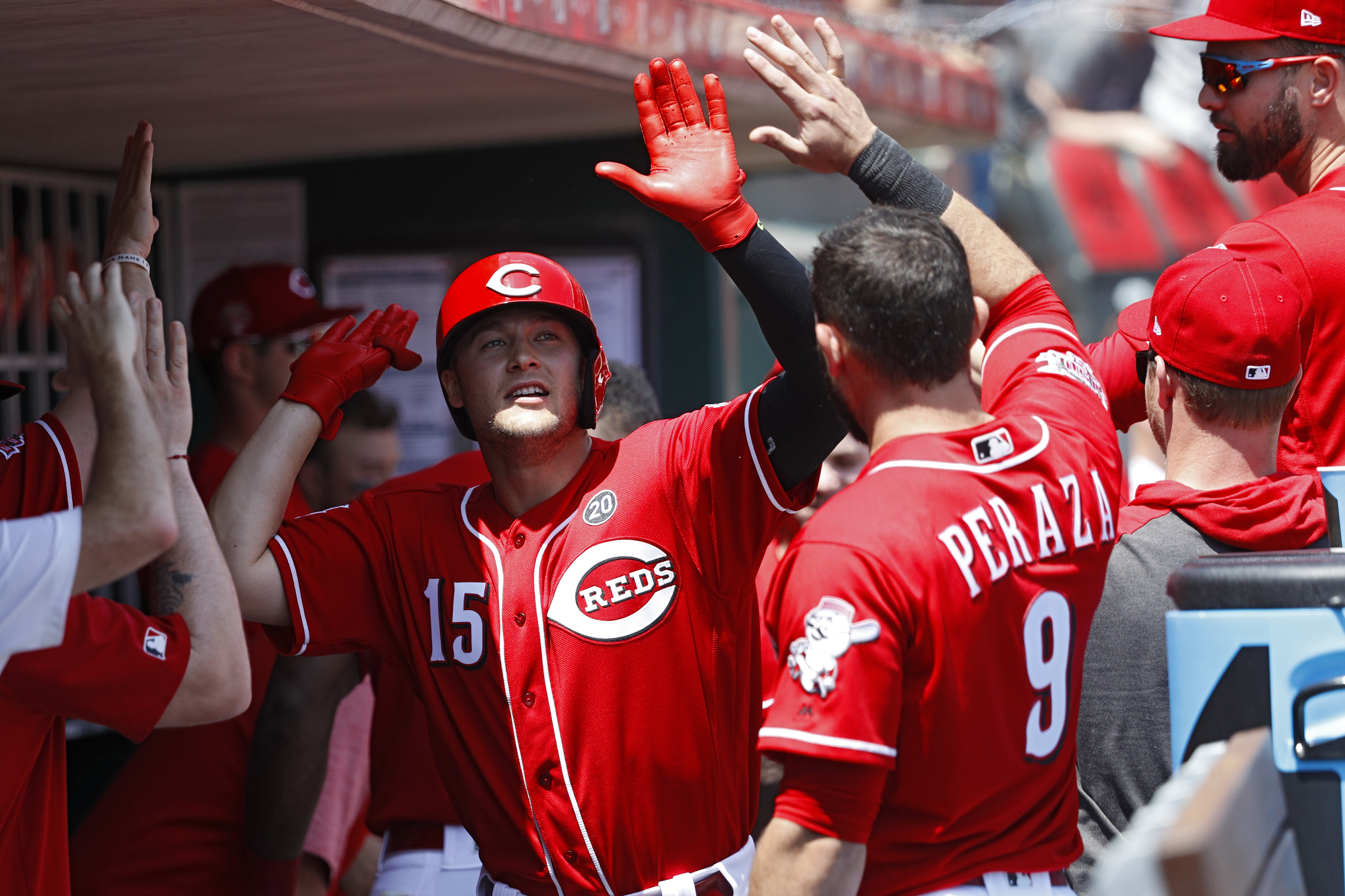 CINCINNATI, OH - MAY 06: Nick Senzel #15 of the Cincinnati Reds is congratulated in the dugout after hitting his second home run of the game in the second inning against the San Francisco Giants at Great American Ball Park on May 6, 2019 in Cincinnati, Ohio. (Photo by Joe Robbins/Getty Images)