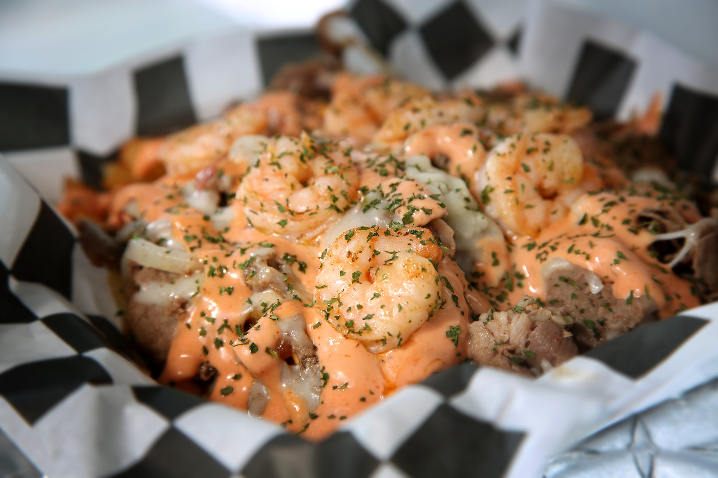 Steak and Shrimp Fries are the specialty at T's Heavenly Taste, a food truck founded by Terri Gates in 2018. Hand-cut fries are topped with steak, shrimp, green and red peppers, onions, cheese sauce and homemade seafood sauce. LISA POWELL / STAFF