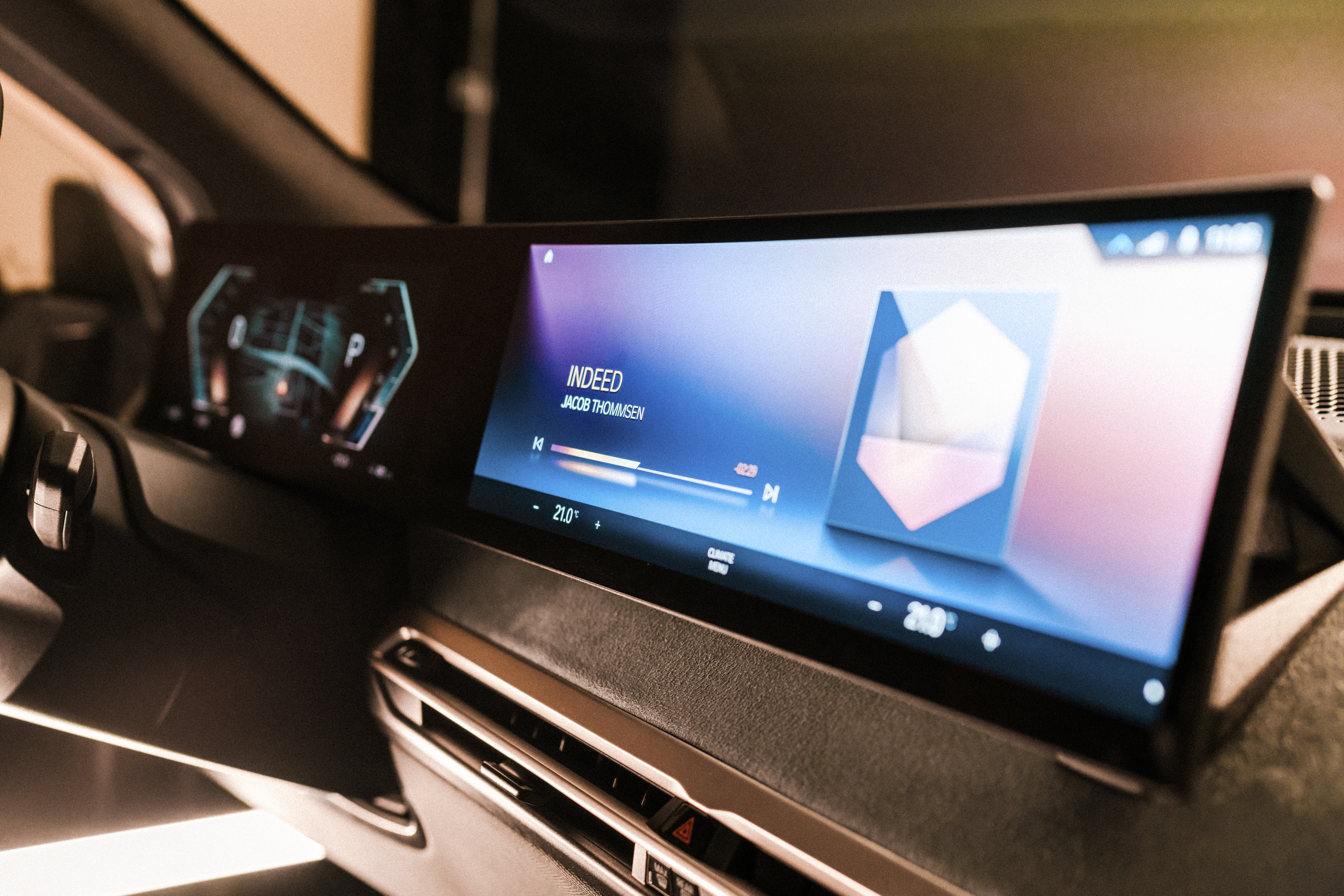 This photo provided by BMW shows the next-generation iDrive operating system and infotainment screen that will debut on the upcoming BMW iX electric vehicle. (BMW of North America via AP)