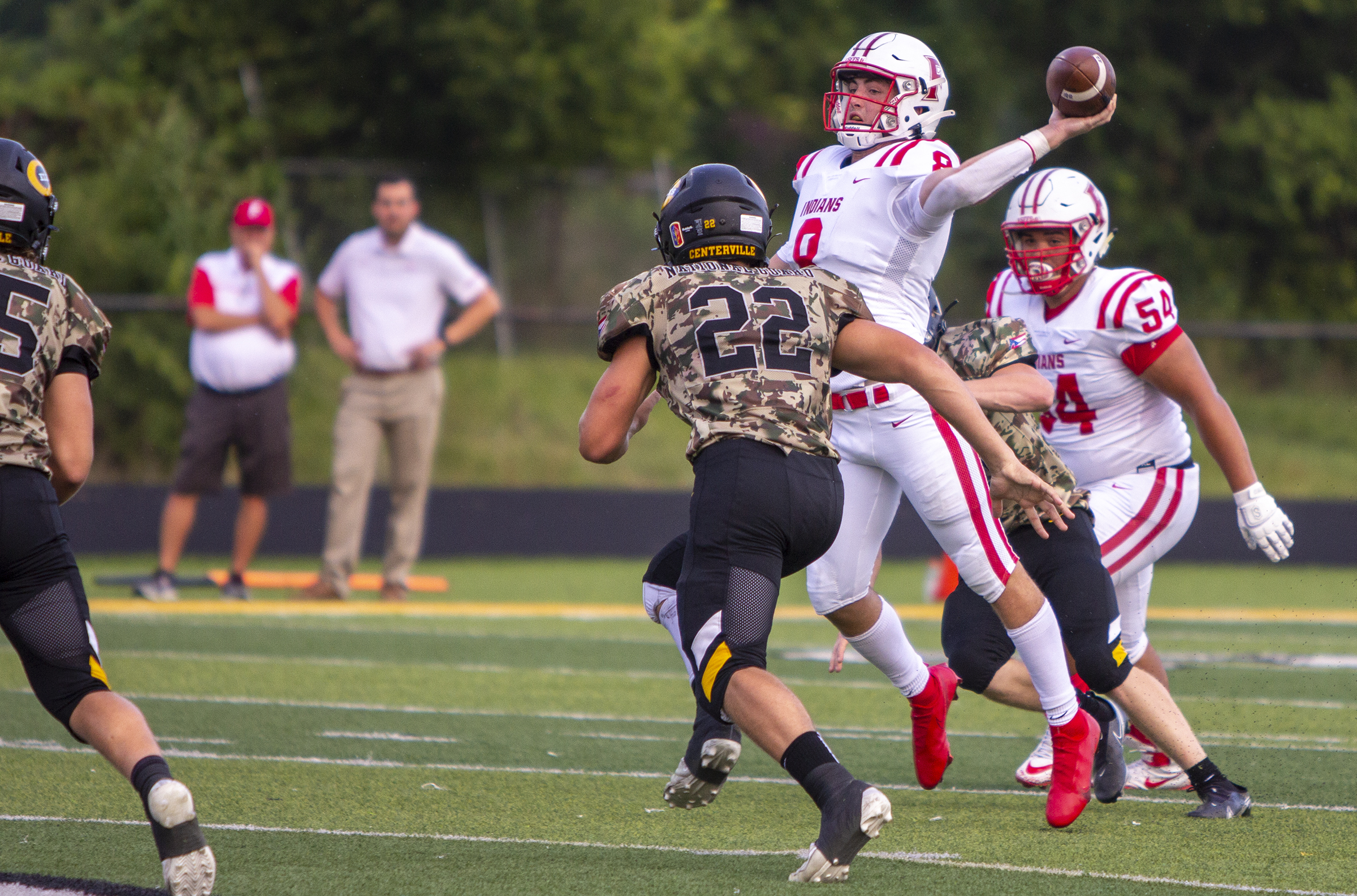 Fairfield quarterback Talon Fisher drops off a short pass that turned into a 61-yard touchdown by Nate Hannah in the first quarter Friday night at Centerville. Jeff Gilbert/CONTRIBUTED