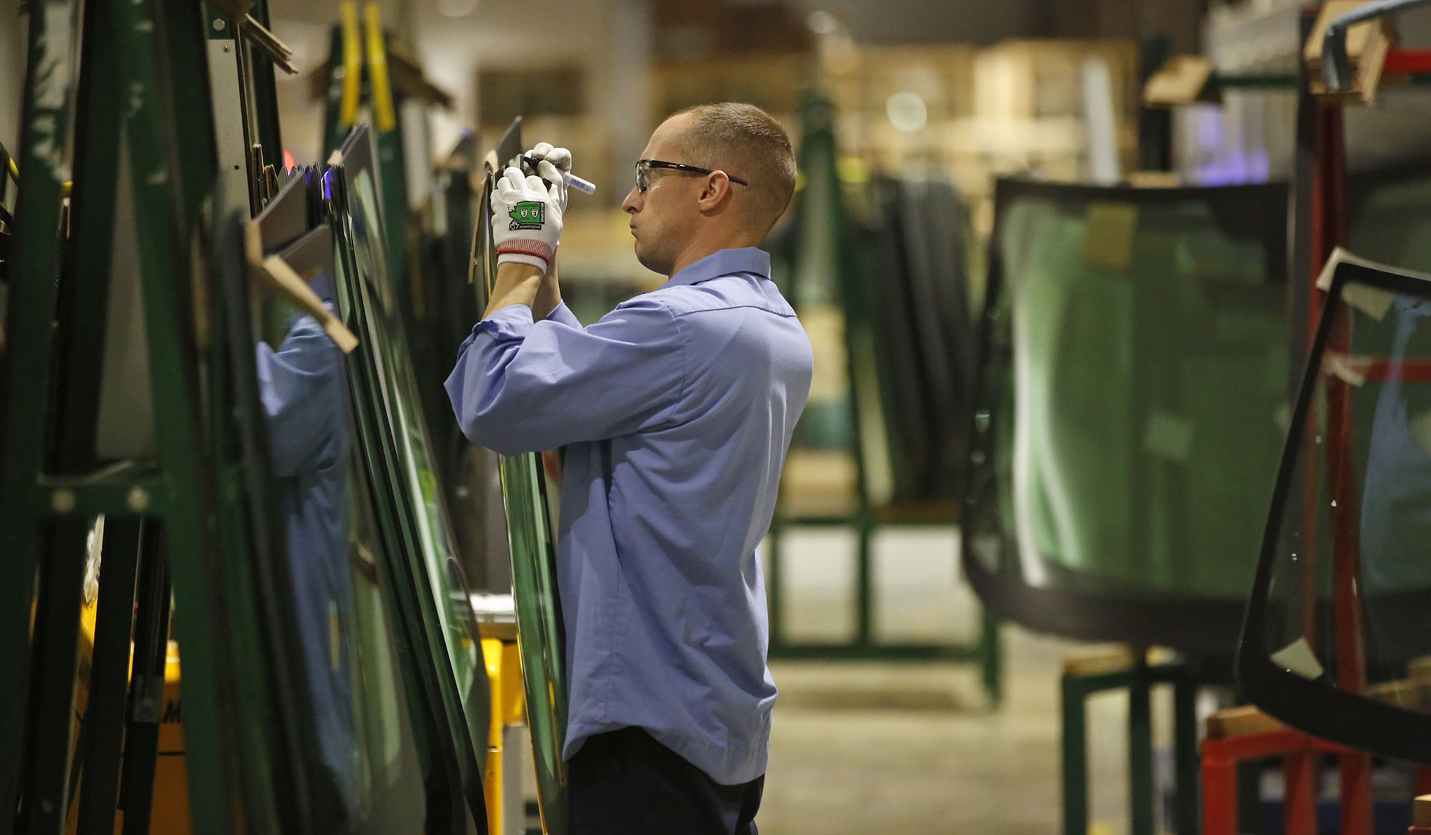 Fuyao Glass America has progressed at a pace that is years ahead of its original schedule and now employs more than 2,000 people. Employees are meticulous about the quality of the glass. TY GREENLEES / STAFF
