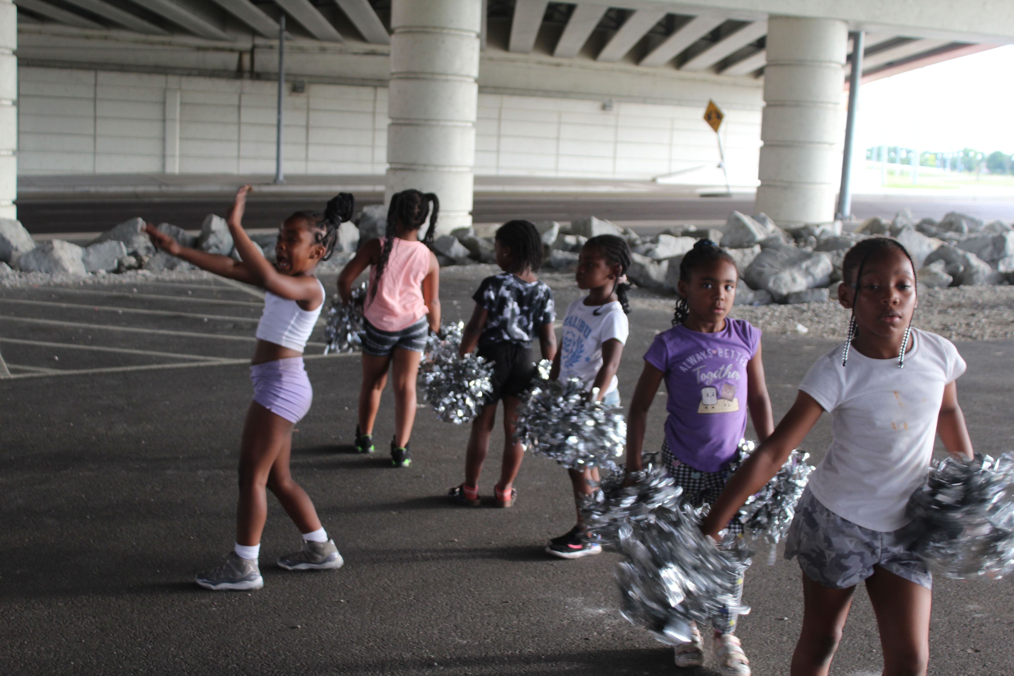 Members of the Western Stars Drill Team & Drum Line practice in a parking lot in downtown Dayton.  CORNELIUS FROLIK / STAFF