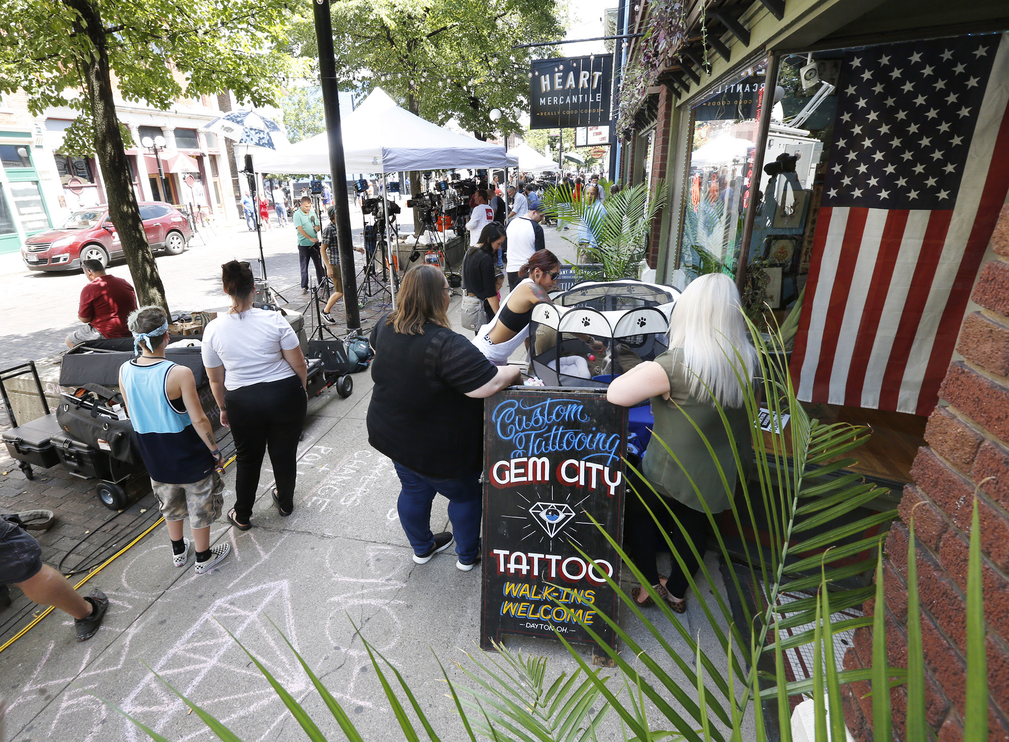 The Oregon District was busy on Monday after a mass shooting early Sunday morning left shop, restaurant and bar owners and residents shocked. TY GREENLEES / STAFF