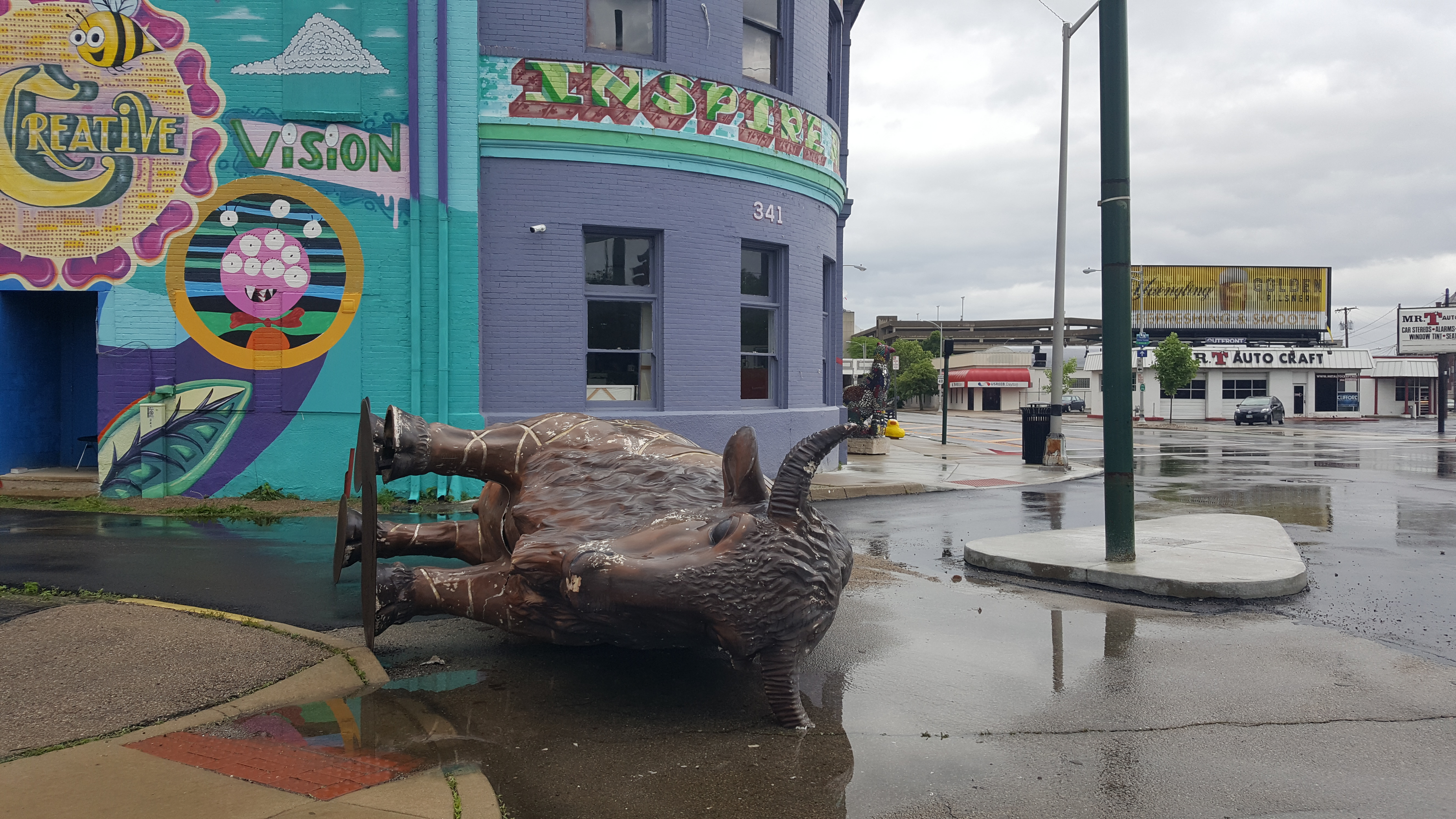 K12 Gallery and TEJAS said she is reviewing the footage from recently installed security cameras installed after vandalism issues to determine whether a large bison statue in front of their Jefferson Street gallery was blown over by the wind or knocked over. CONTRIBUTED