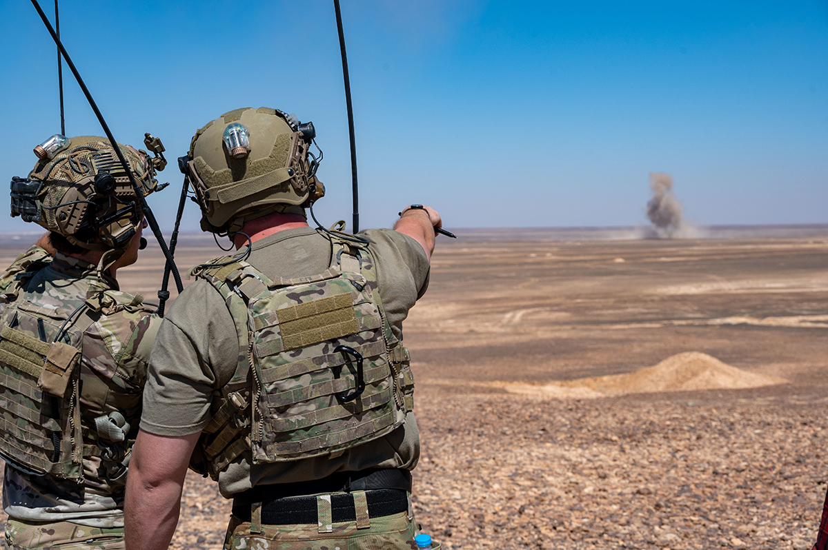 Two Joint Terminal Attack Controllers observe a bomb impact during a routine training exercise with 332nd Air Expeditionary Wing F-15E Strike Eagles at an undisclosed location in southwest Asia on July 7. The F-15E is a dual-role fighter designed to perform air-to-air and air-to-ground missions with an array of avionics and electronics systems that give it the capability to fight at low altitude, day, night and in all weather conditions. U.S. AIR FORCE PHOTO/MASTER SGT. KELLY GOONAN