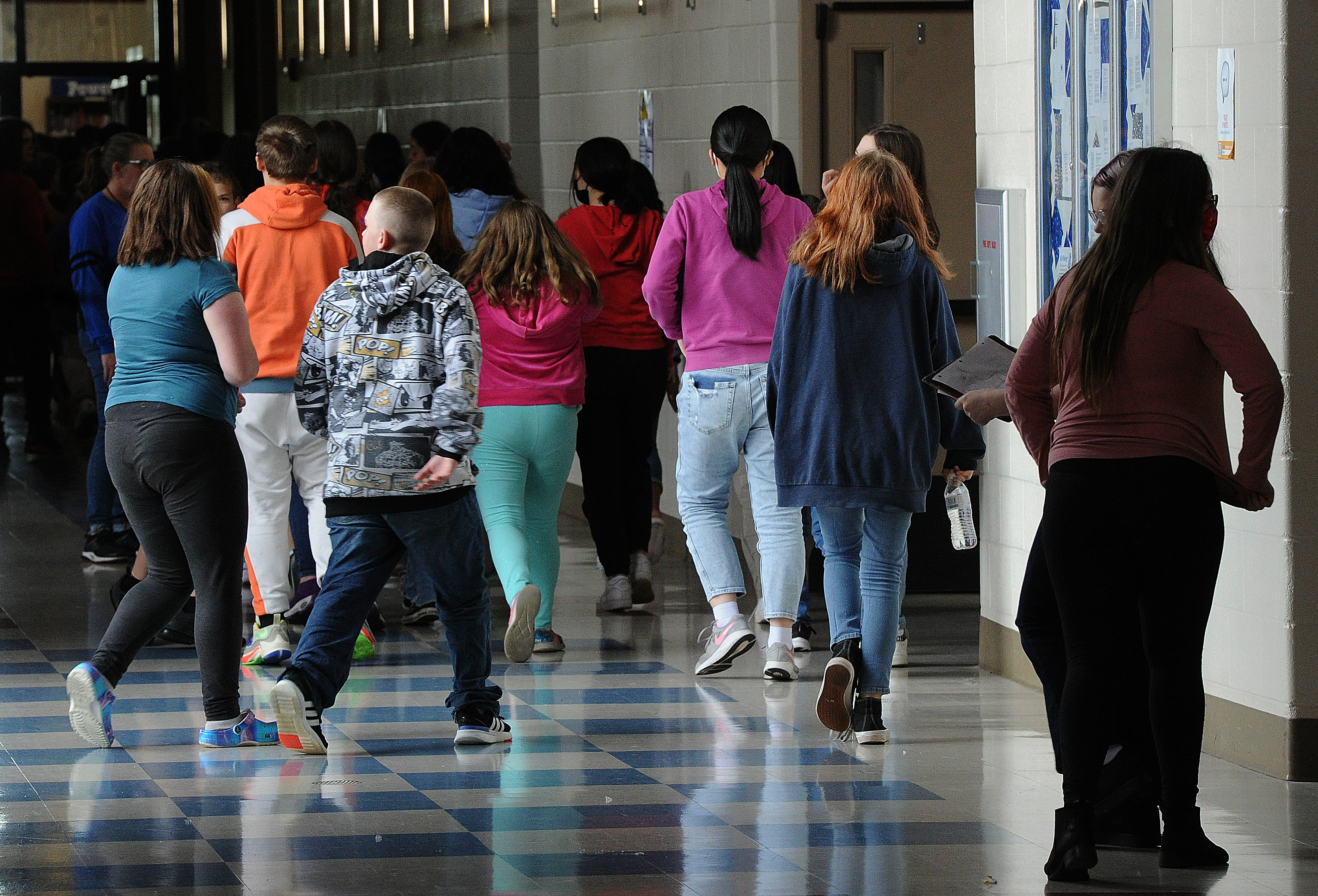 Students at Miamisburg Middle School walk through the hallways on May 5. Miamisburg is one of the schools in the region who have added mental health staff and are working to support students and teachers after a difficult two years. School and hospital officials are concerned about teen's mental health across the Miami Valley. Marshall Gorby \ Staff