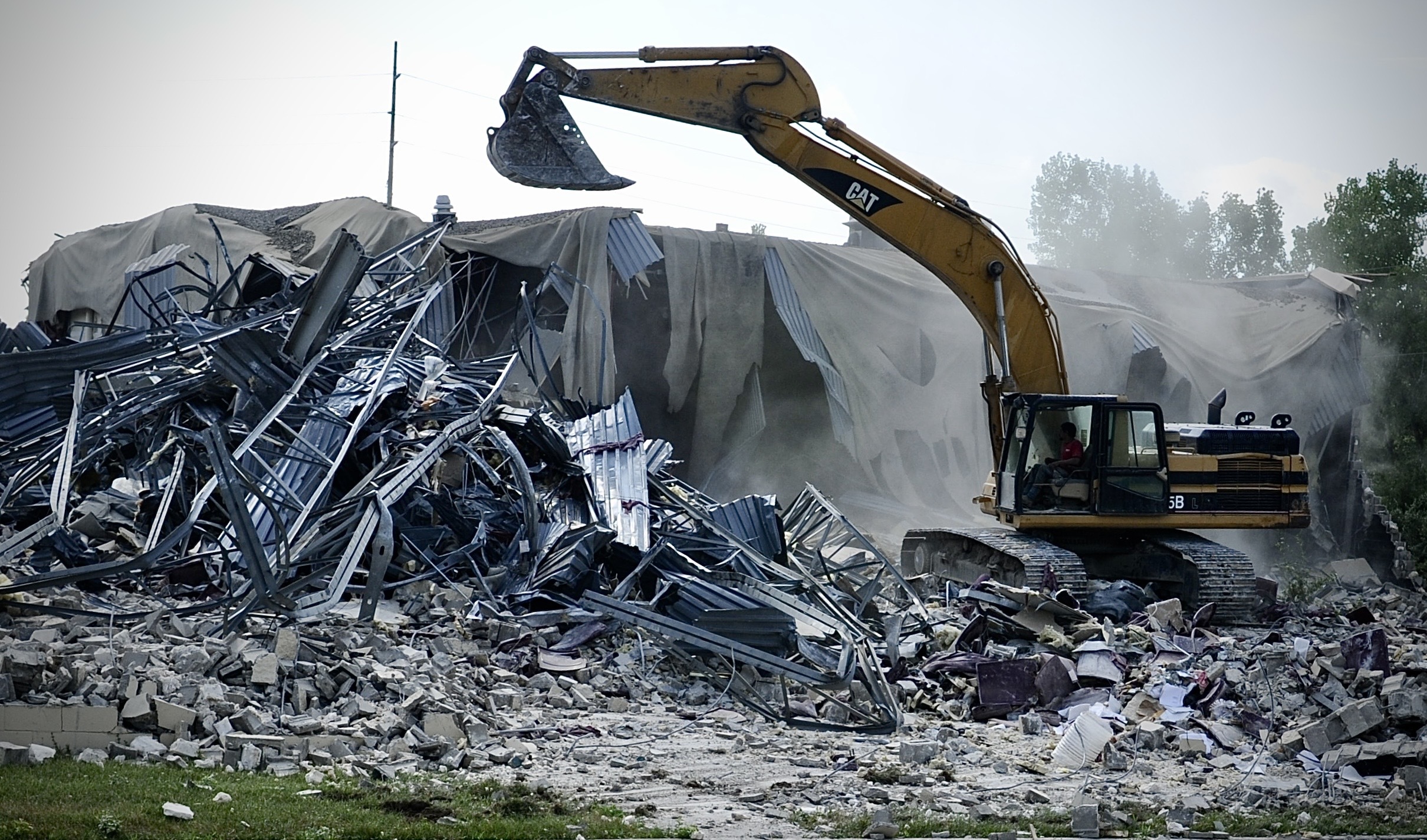 Crews demolish the former site of Danbarry Cinemas behind the Dayton Mall in Miami Twp. Tuesday, July 12, 2022.
MARSHALL GORBY/STAFF