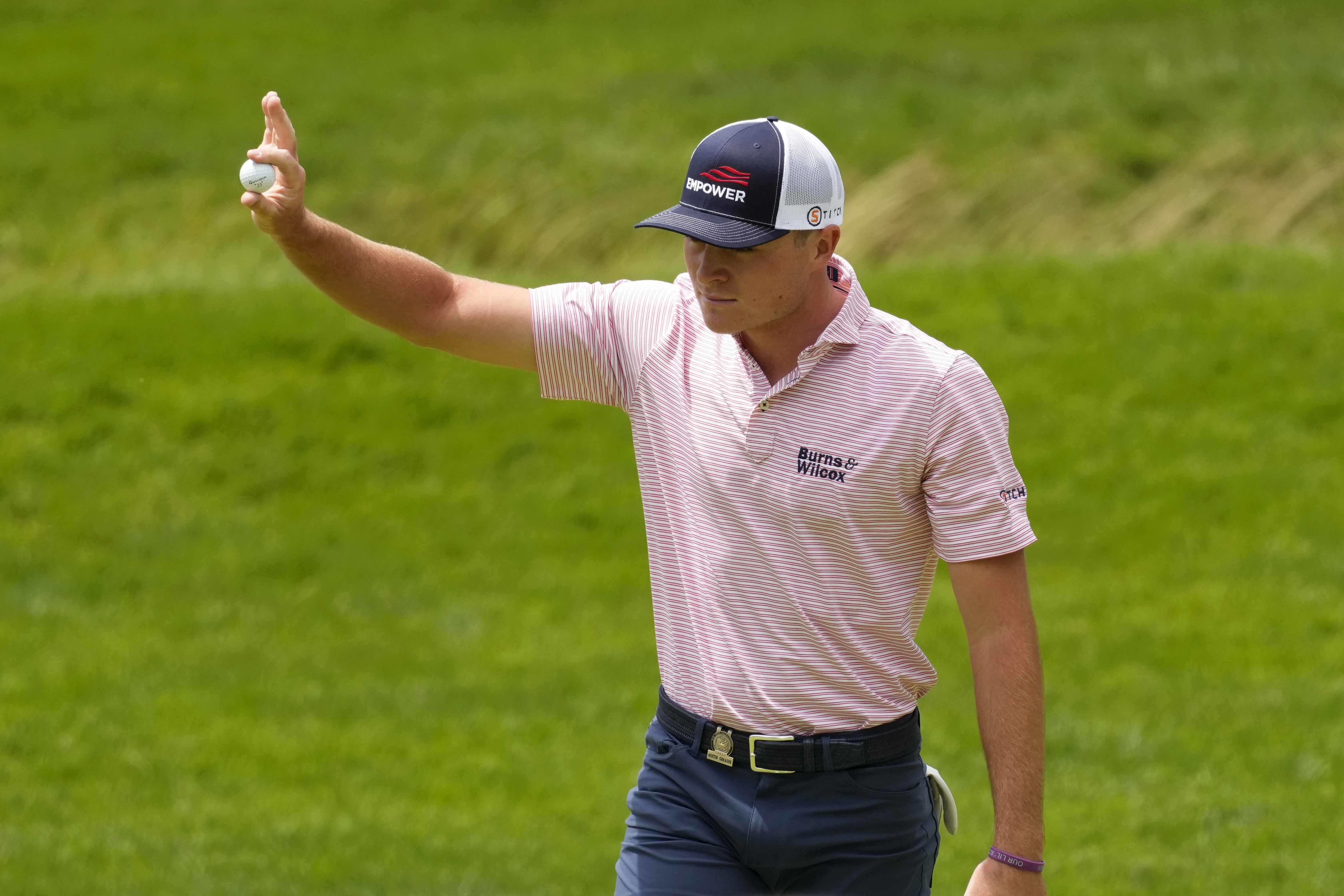 Austin Greaser reacts after a putt on the 12th hole during the first round of the U.S. Open golf tournament at The Country Club, Thursday, June 16, 2022, in Brookline, Mass. (AP Photo/Charlie Riedel)