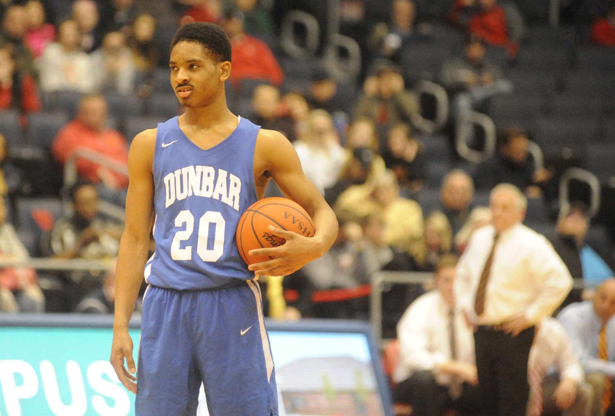 Michael Elmore of Dunbar holds the ball during a 27-26 defeat of Fenwick in a D-II sectional final on Wednesday night at UD Arena. MARC PENDLETON / STAFF
