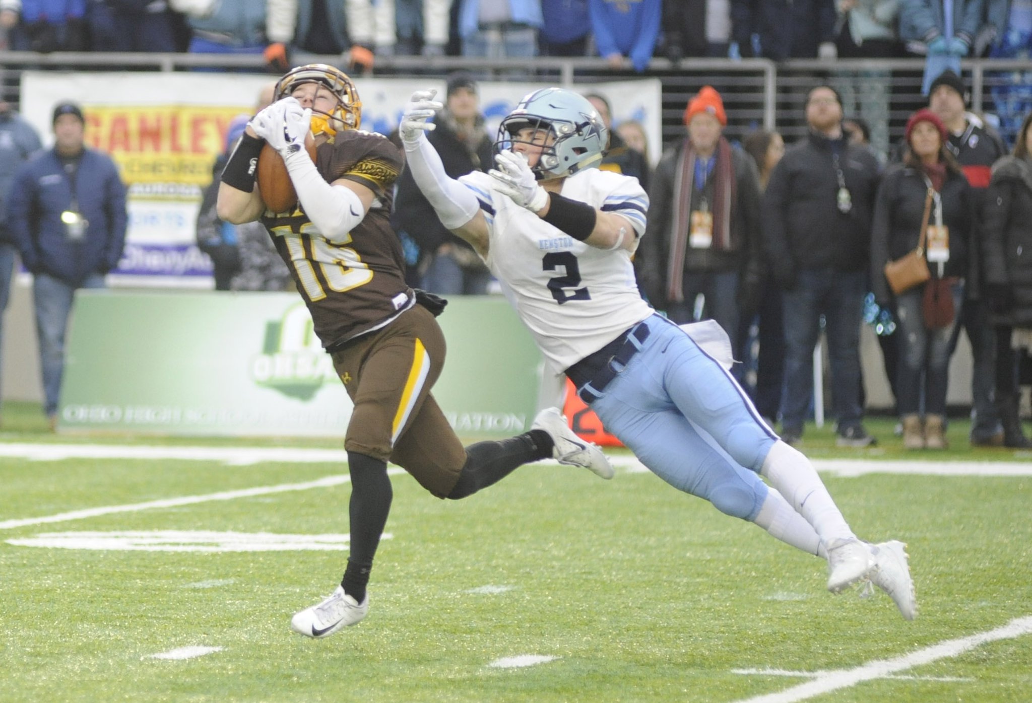 Alter’s Jack DiMario makes a catch over defender Tyler Mintz. Alter played Chagrin Falls Kenston in a D-III high school football state championship at Canton’s Tom Benson Hall of Fame Stadium on Friday, Nov. 30, 2018. MARC PENDLETON / STAFF