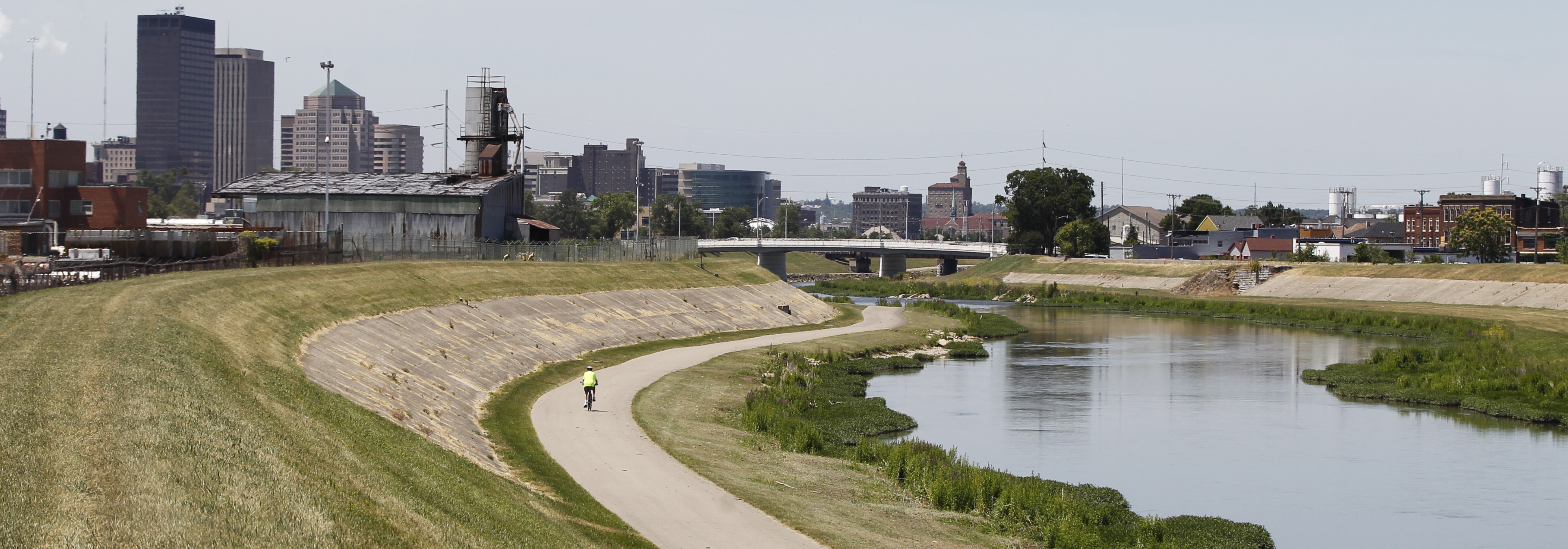 A runner exercises during the lunch-hour on the Mad River Trail that runs from the Great Miami River to Eastwood park and is part of the Miami Valley Bike Trails network that includes more than 300 miles of trail to explore.--Staff Photo by Ty Greenlees