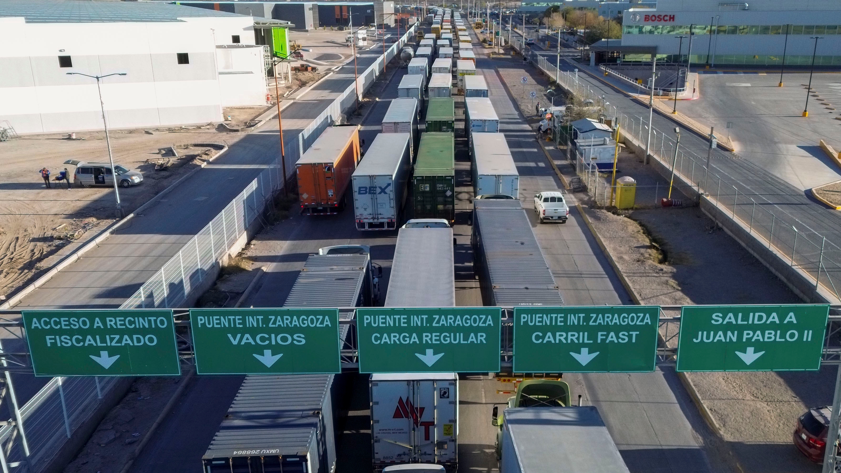 Trump pauses tariffs on Mexico and Canada for one month - Automotive News