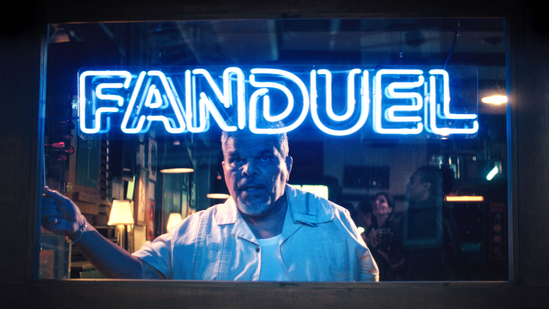 Luis Guzmán presides over a bar of sports bettors in FanDuel SportsBook ads