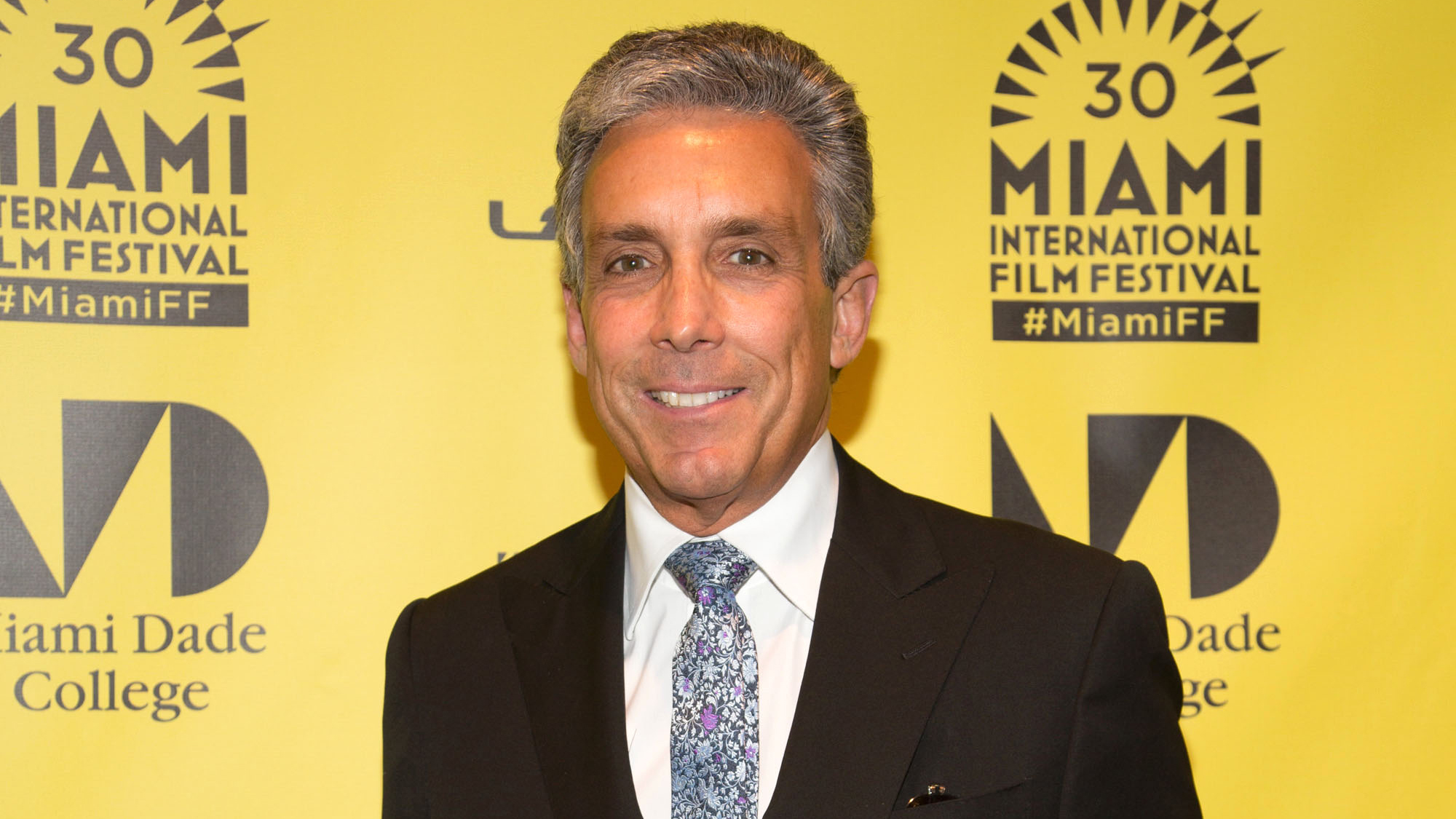 Real estate dynasties clash as landlord threatens to seize building owned by Charles Cohen