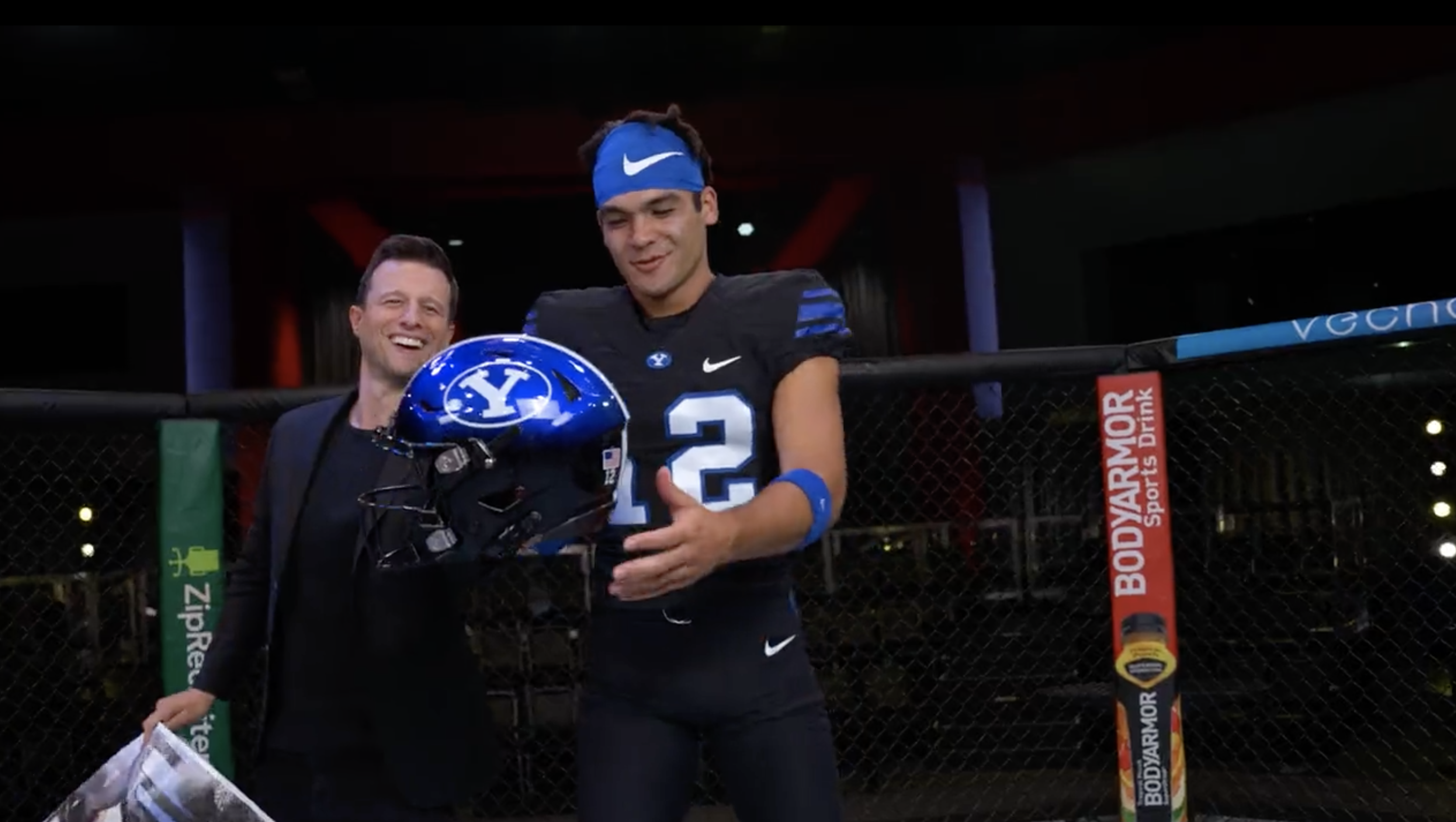 Byu football uniforms with the jersey being royal blue and side stripes  cougar tan. the helmets are cougar tan with a royal blue block cougar logo  on Craiyon