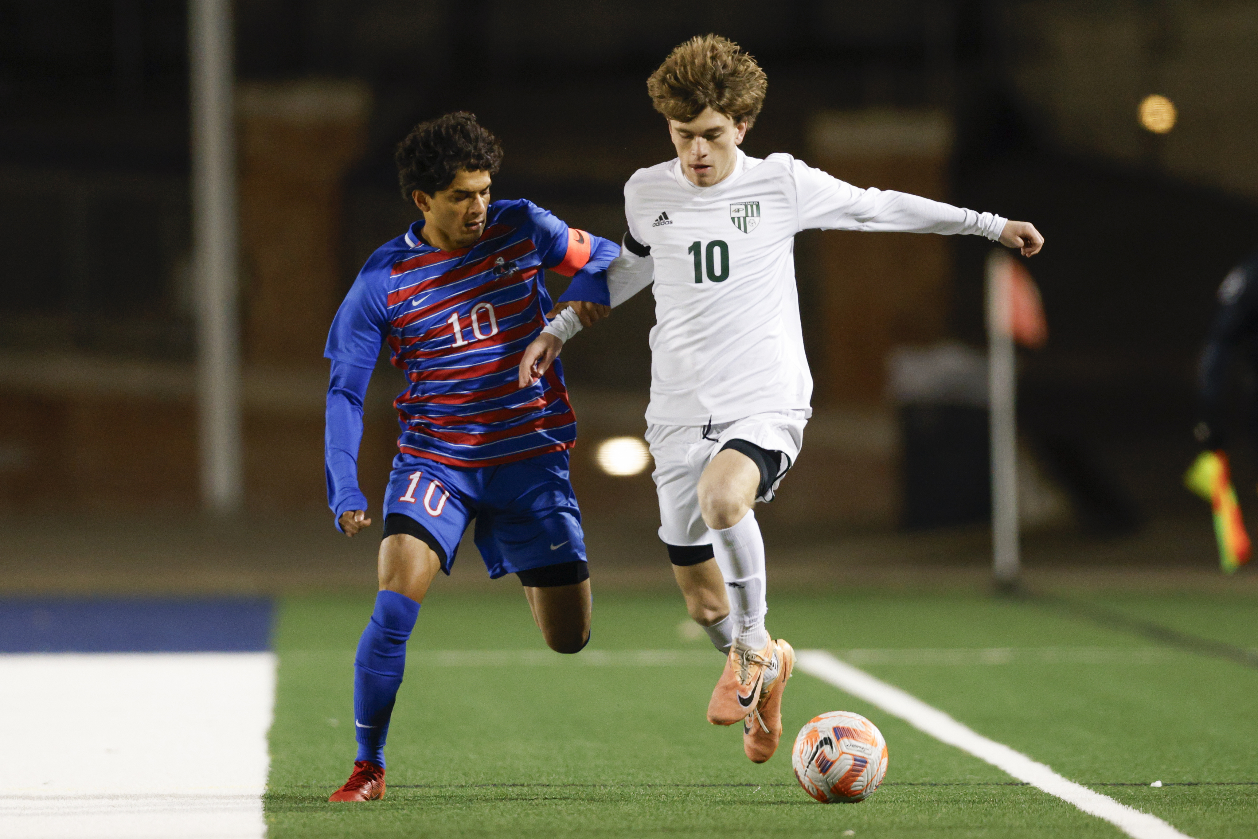 Prosper’s Caden Berg (right) pushes the ball down the field as Allen’s Zayan Ahmed (10)...