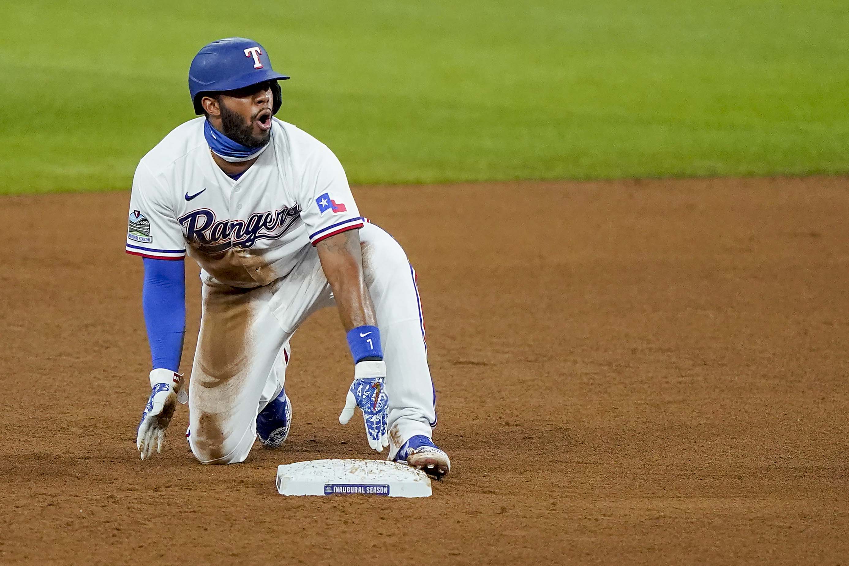 Texas Rangers shortstop Elvis Andrus (1) leaps over Houston Astros