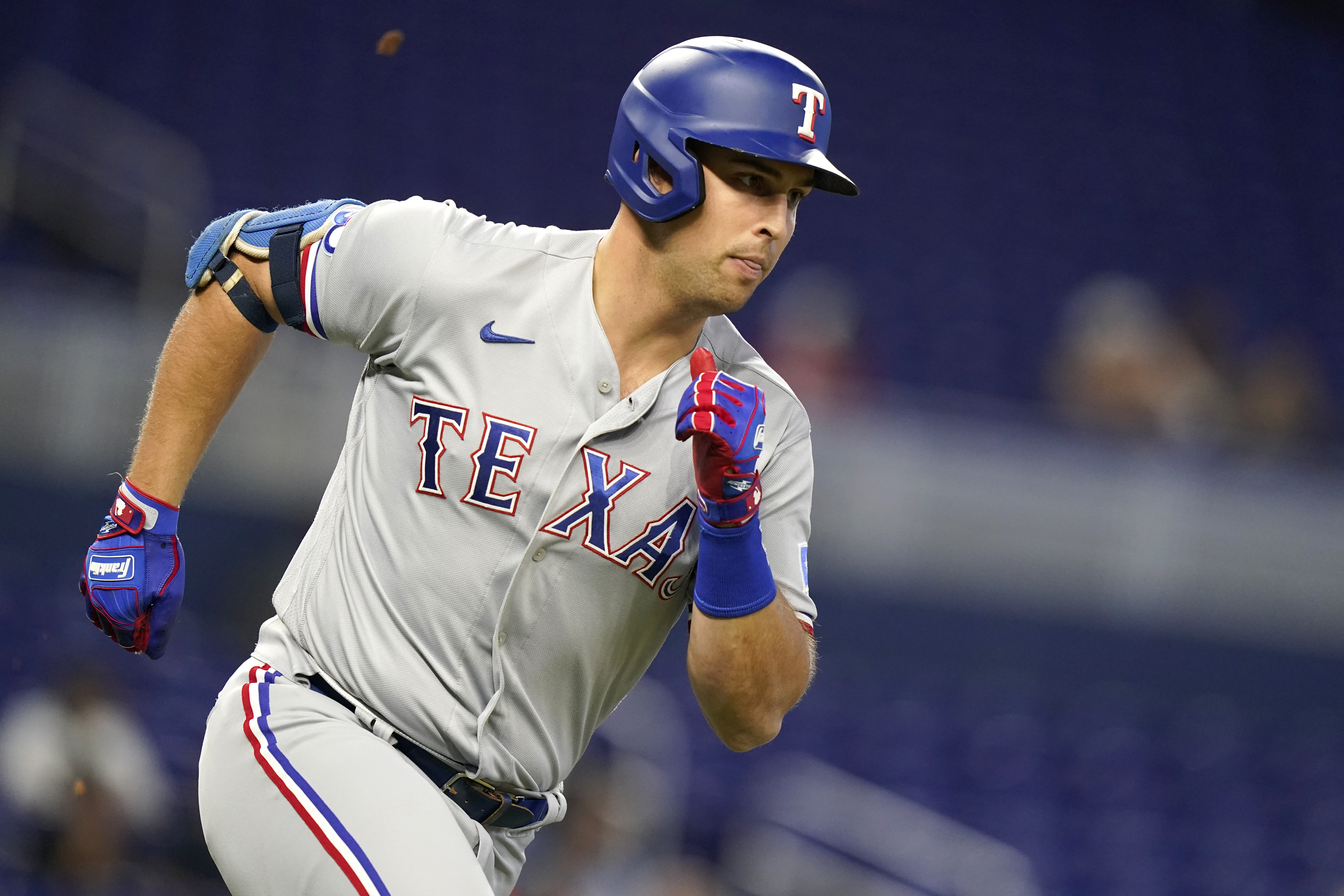 Texas Rangers' Nathaniel Lowe runs the bases after hitting a solo home run  during the fourth inning of a baseball game against the Cleveland Guardians  in Arlington, Texas, Friday, July 14, 2023. (