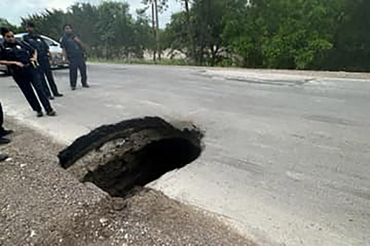 A large sinkhole appeared Friday morning in southeastern Dallas County, shutting down a road...