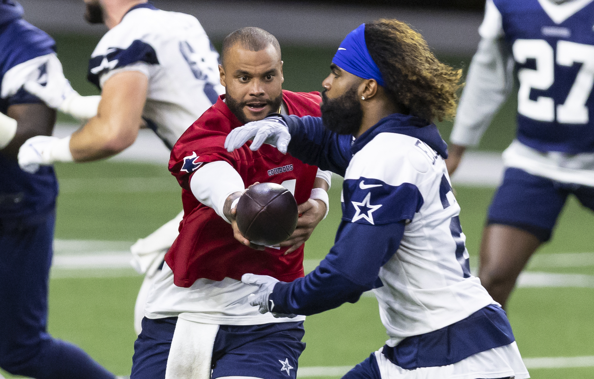 Dallas Cowboys cornerback Isaac Taylor-Stuart runs with the ball