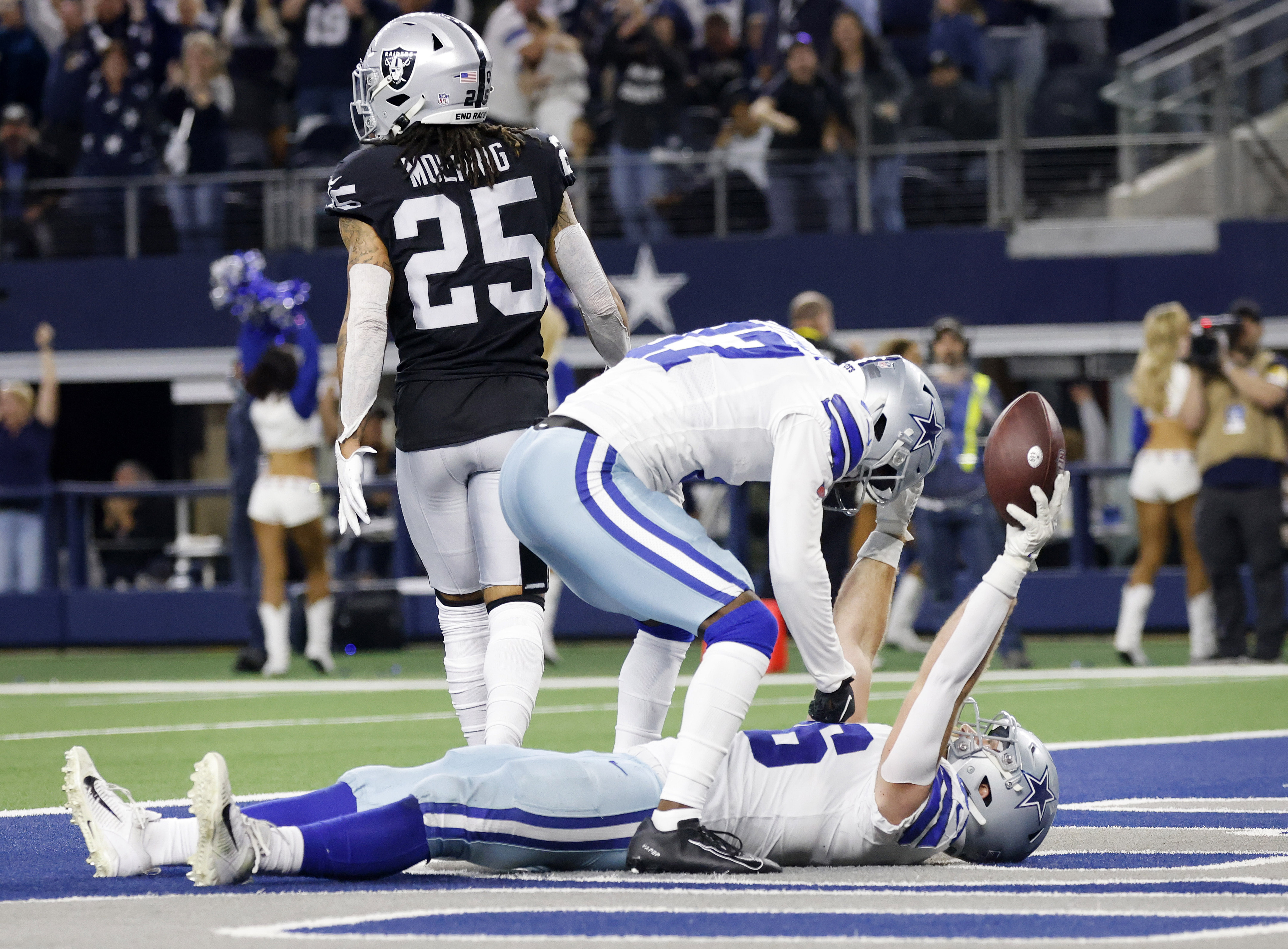 A Dallas Cowboys fan wears a turkey hat before an NFL football game against  the Raiders on Thur …