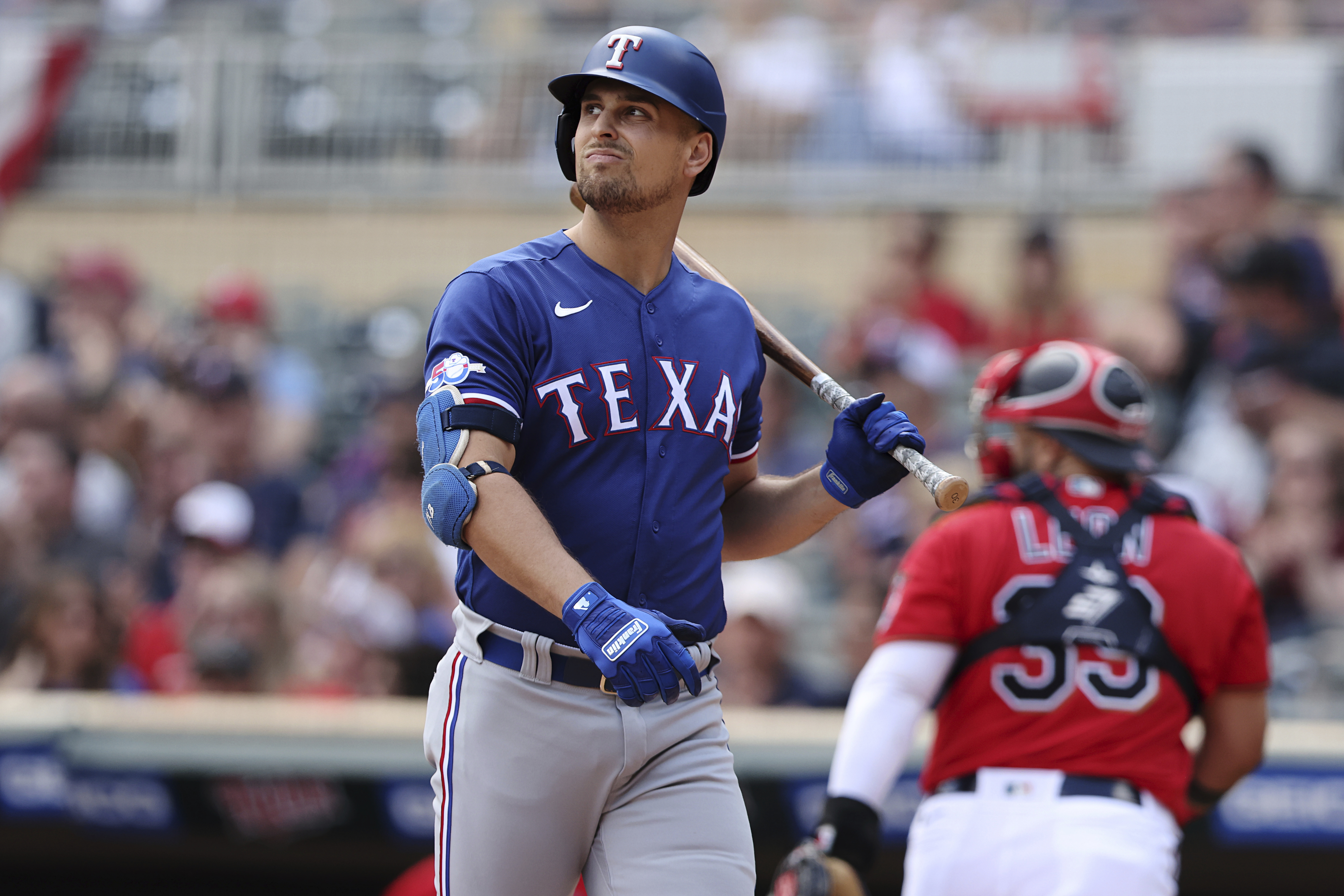 Nate Lowe of the Texas Rangers reacts after hitting the game winning